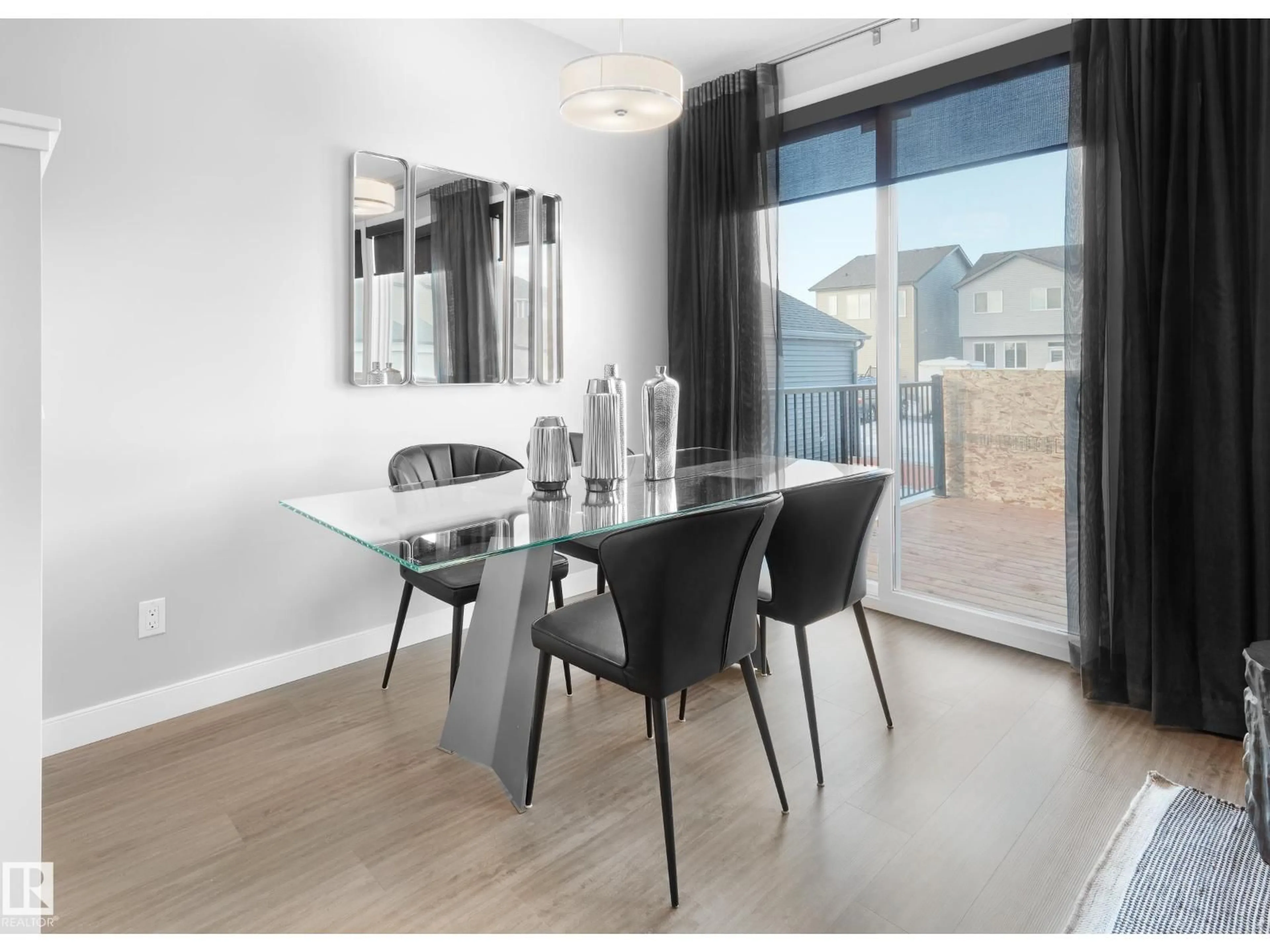 Dining room, wood/laminate floor for 5645 HAWTHORN WY, Edmonton Alberta T6X3K7