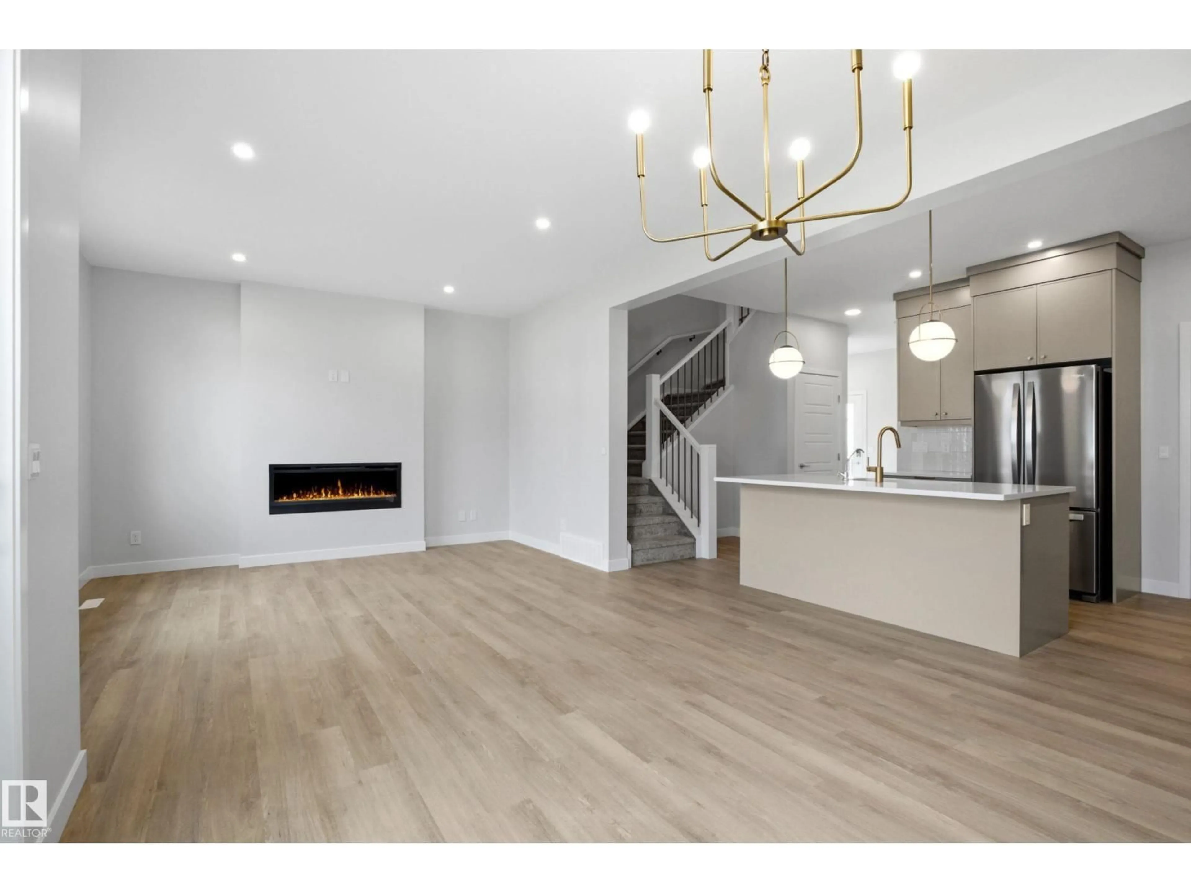 Open concept kitchen, wood/laminate floor for 2372 MUCKLEPLUM WY, Edmonton Alberta T6X3K1