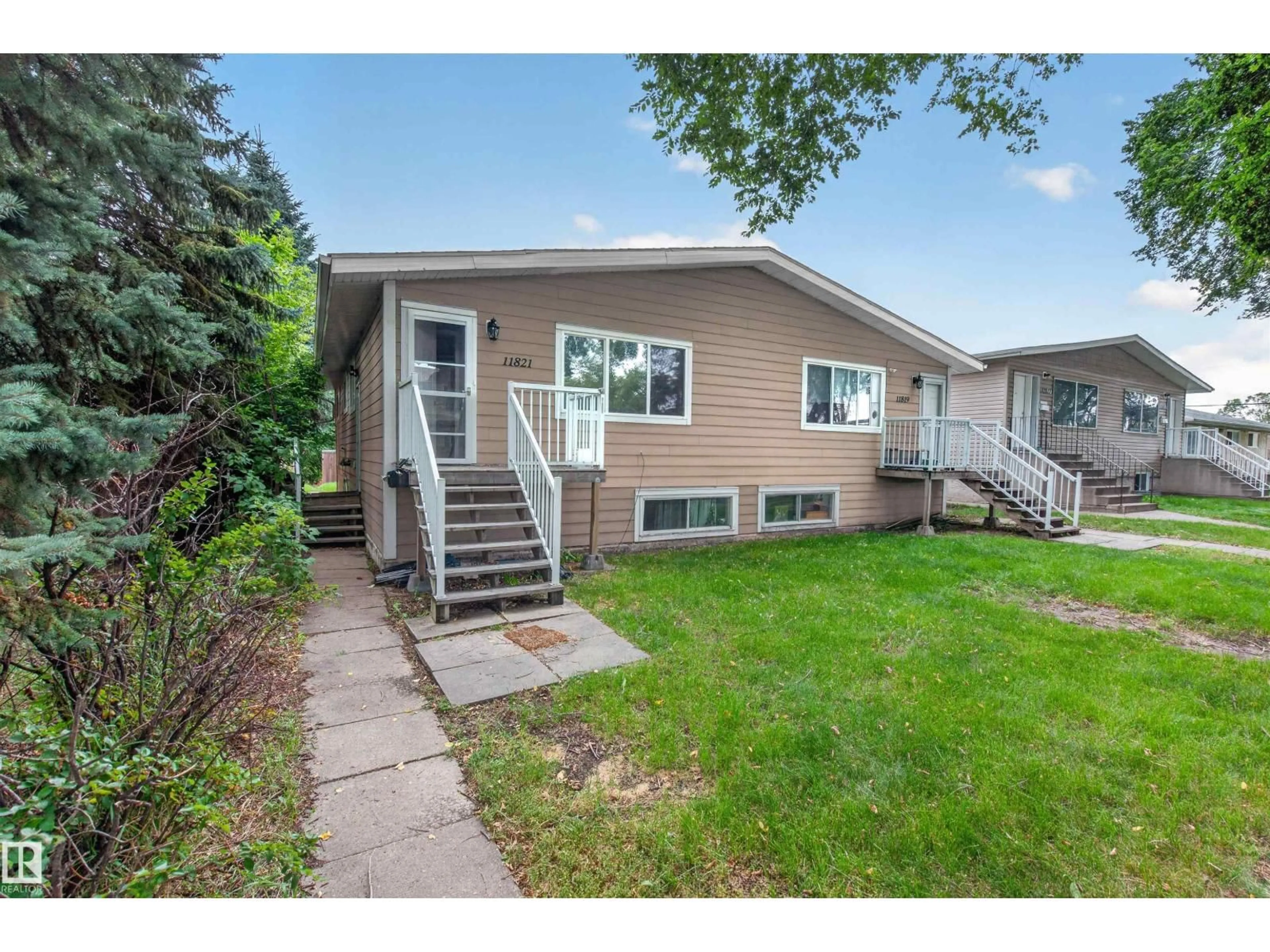 Home with vinyl exterior material, street for NW - 11819-21 40 ST, Edmonton Alberta T5W2K7