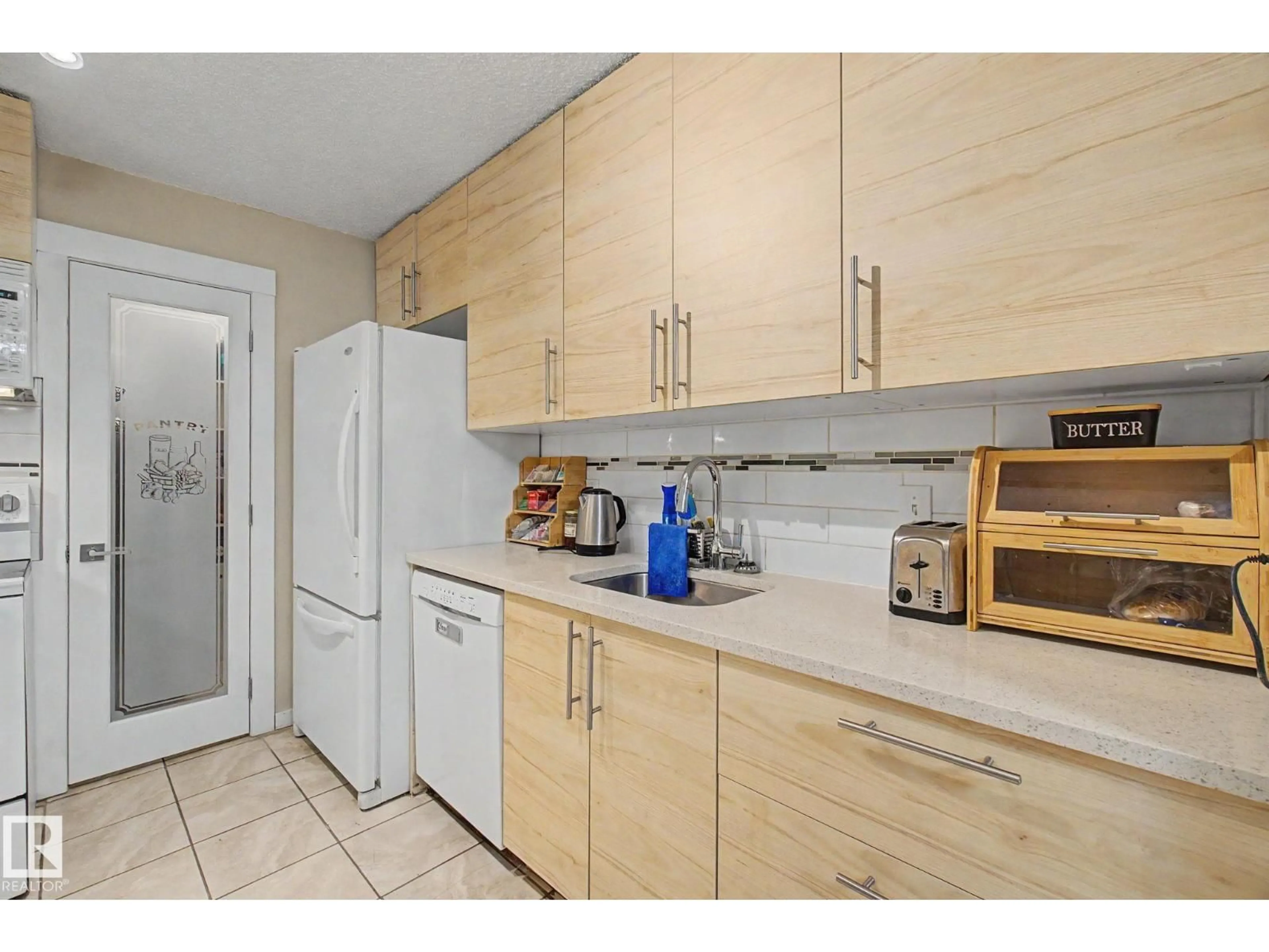 Standard kitchen, ceramic/tile floor for 3111 142 AV, Edmonton Alberta T5Y2H6