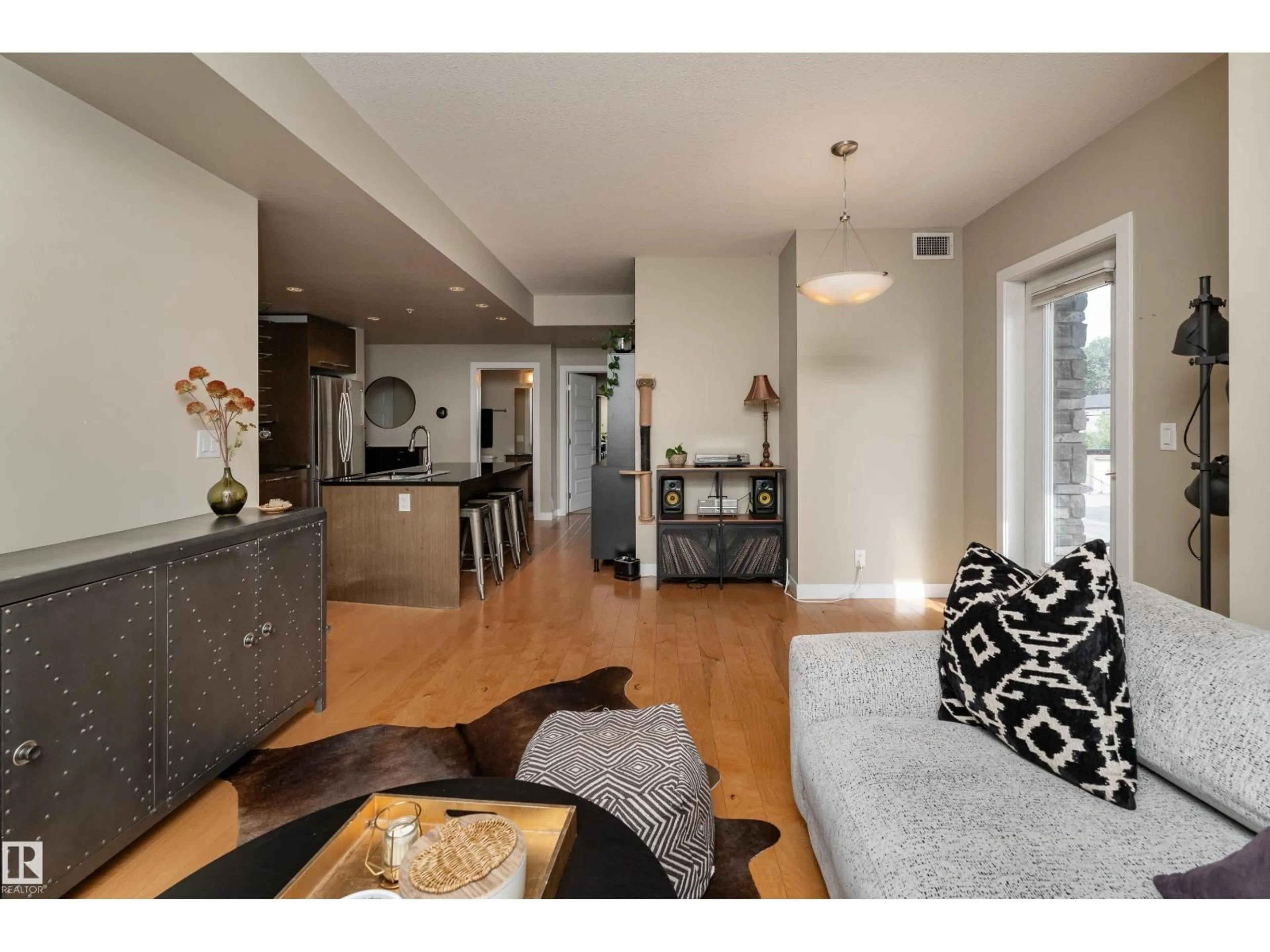 Living room with furniture, wood/laminate floor for 204 - 9908 84 AV, Edmonton Alberta T6E2G3