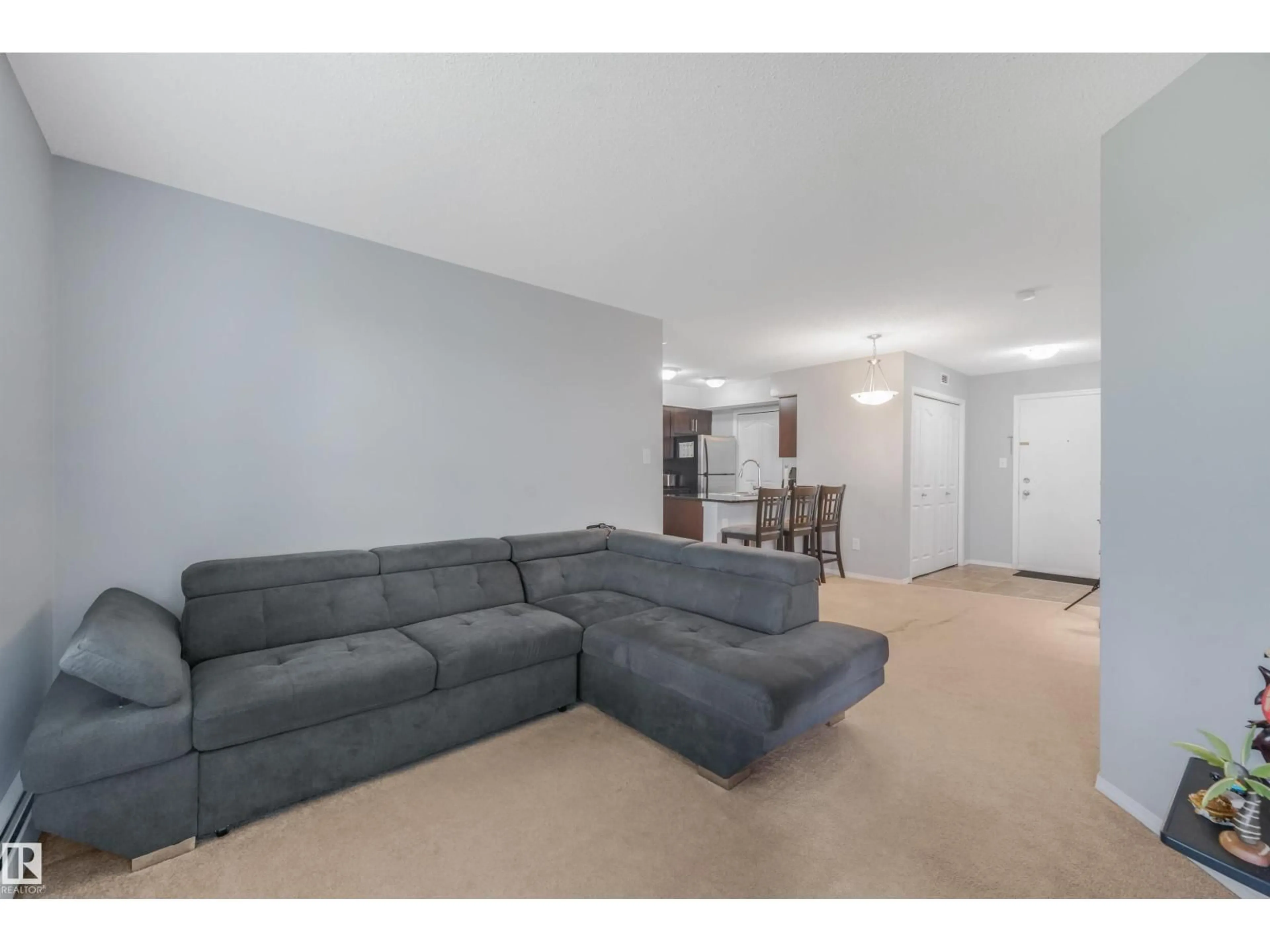 Living room with furniture, unknown for #408 - 1070 MACCONACHIE BV, Edmonton Alberta T5Y0X1