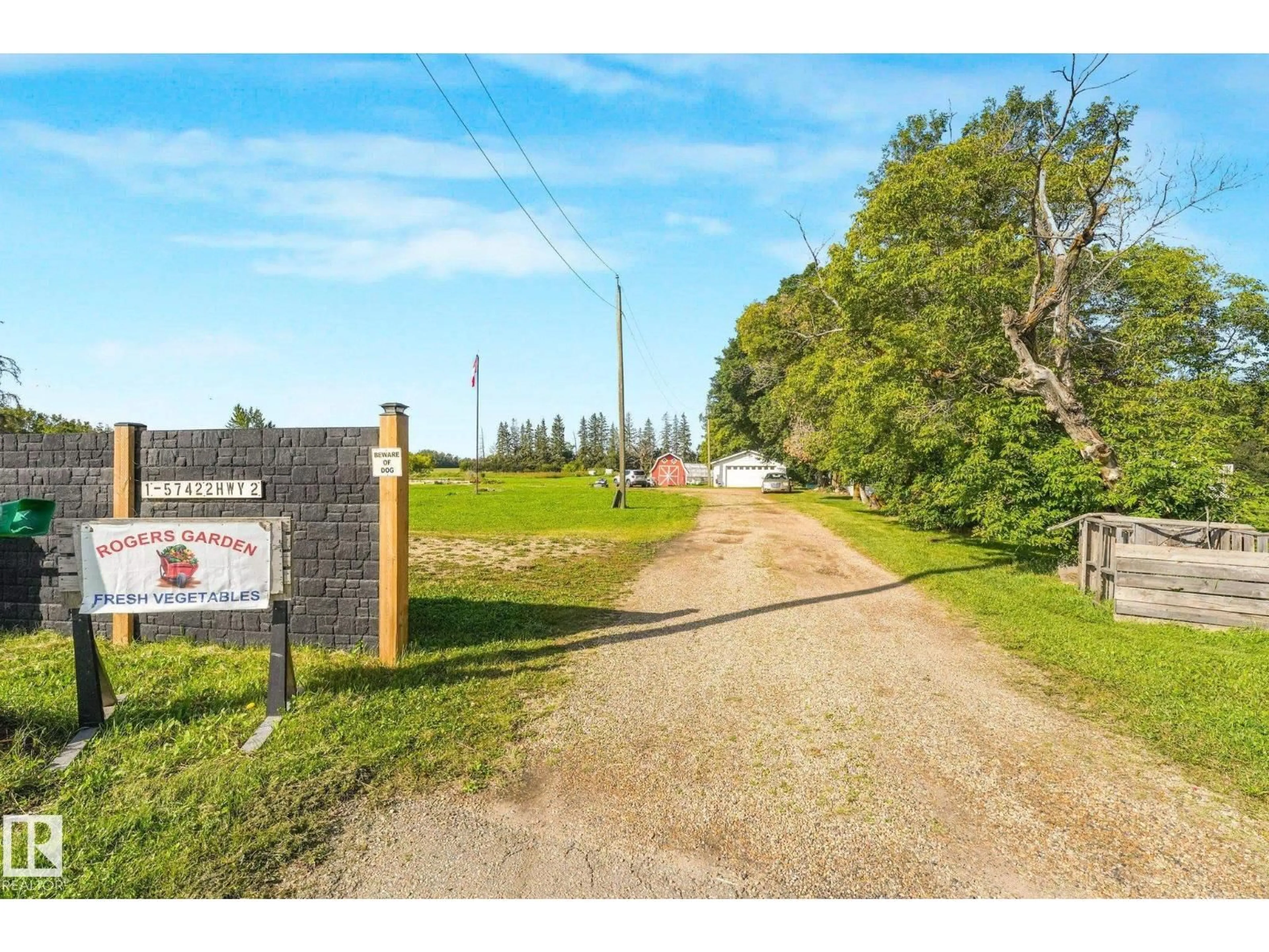 A pic from outside/outdoor area/front of a property/back of a property/a pic from drone, street for #2 - 57422 HWY 2, Rural Sturgeon County Alberta T0G1L0