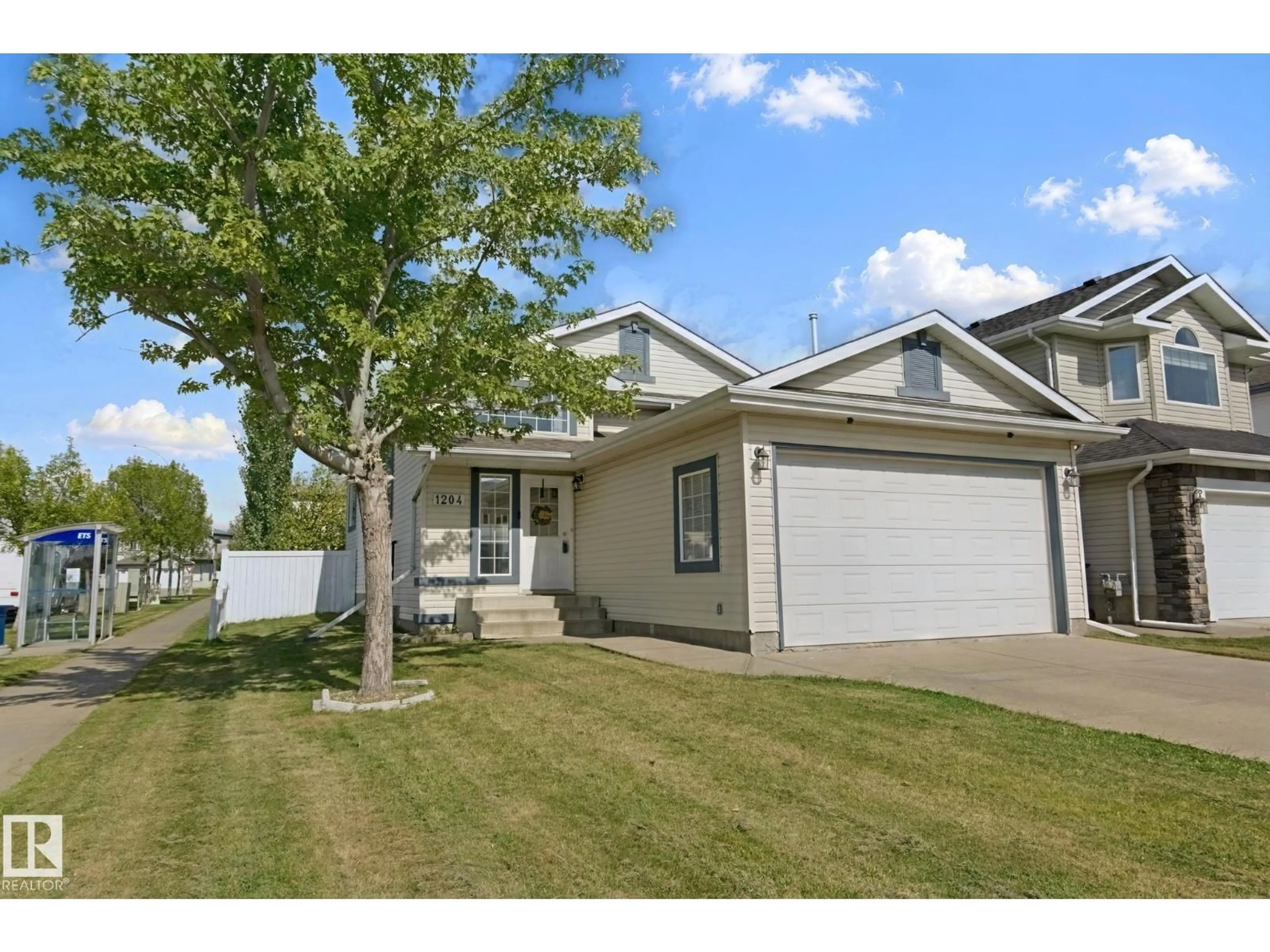 Home with vinyl exterior material, street for NW - 1204 KLARVATTEN CT, Edmonton Alberta T5Z3N4
