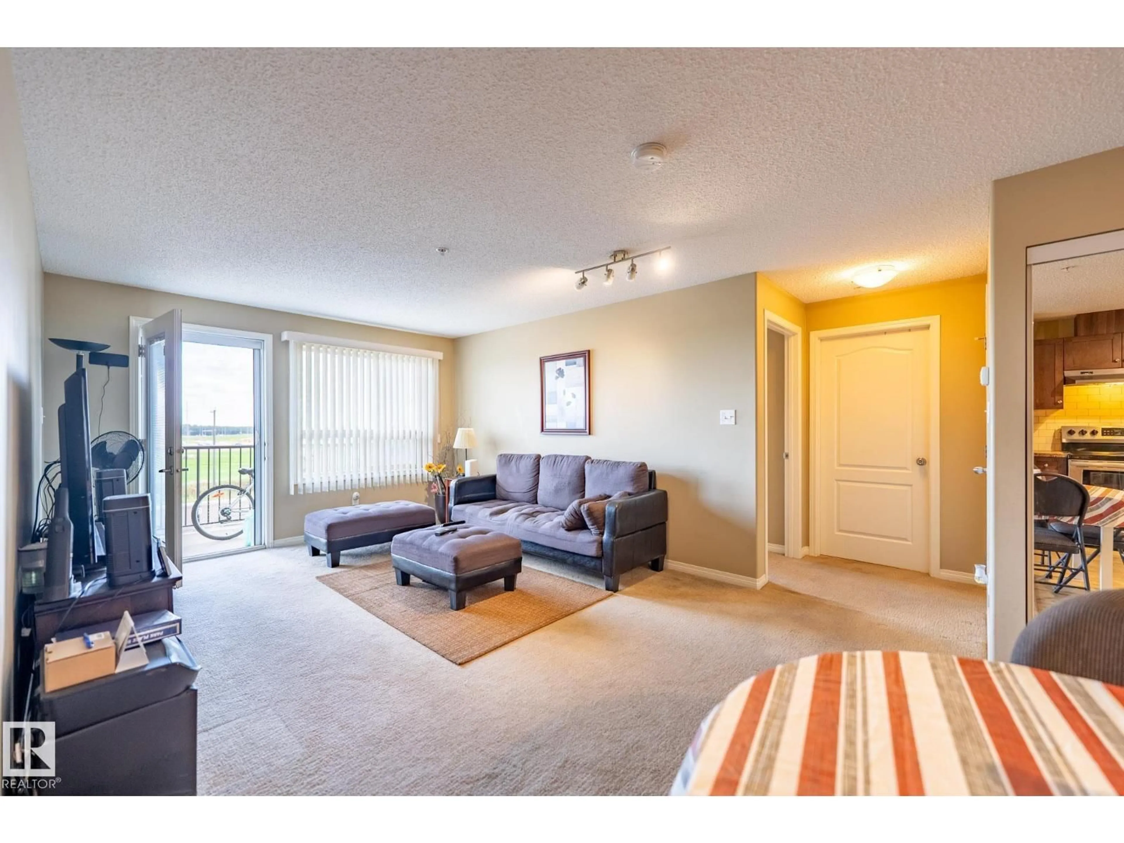 Living room with furniture, carpet floor for #320 - 1520 HAMMOND GA, Edmonton Alberta T6M0J4