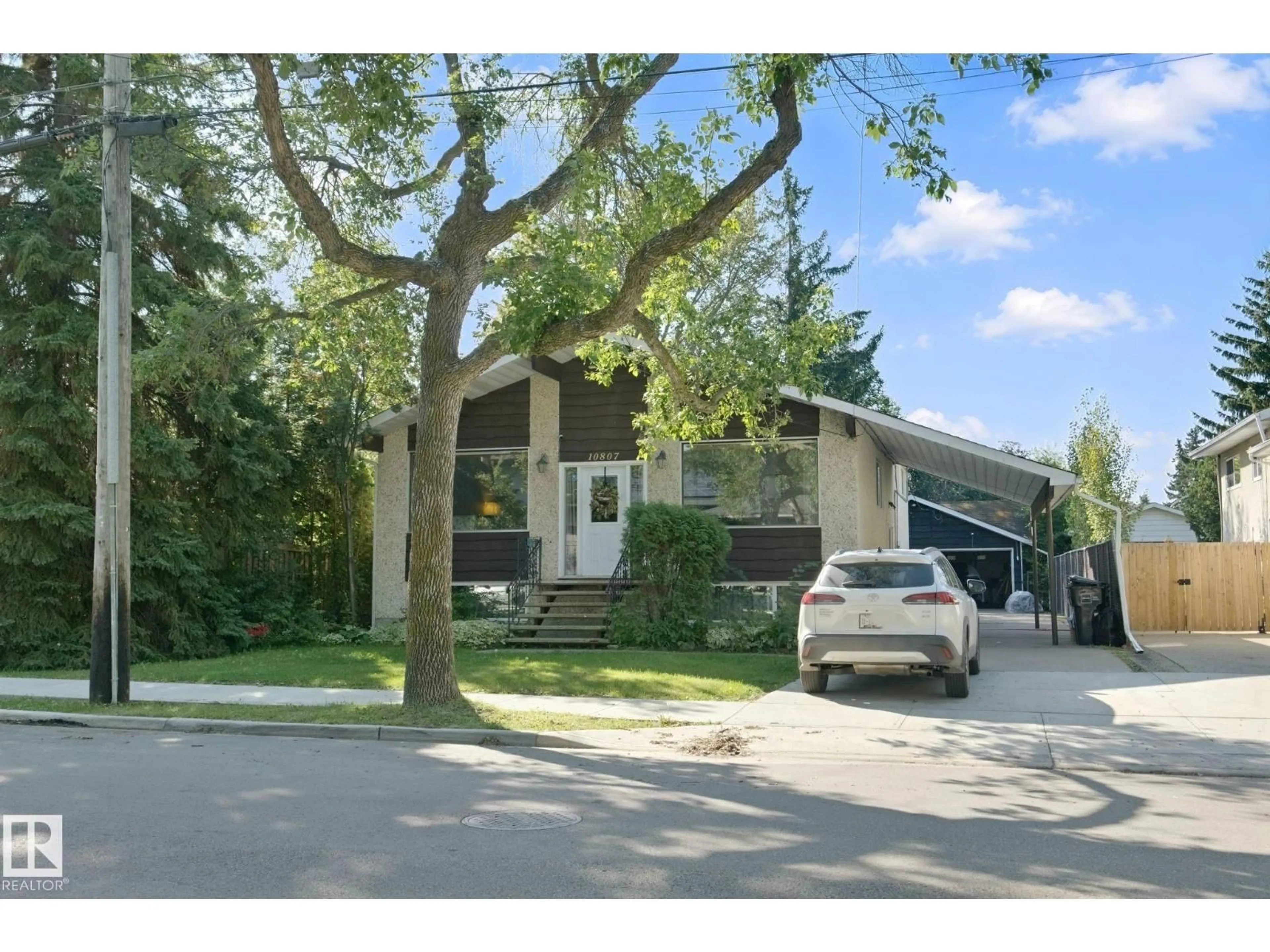 Home with vinyl exterior material, street for 10807 54 AV, Edmonton Alberta T6H0T8