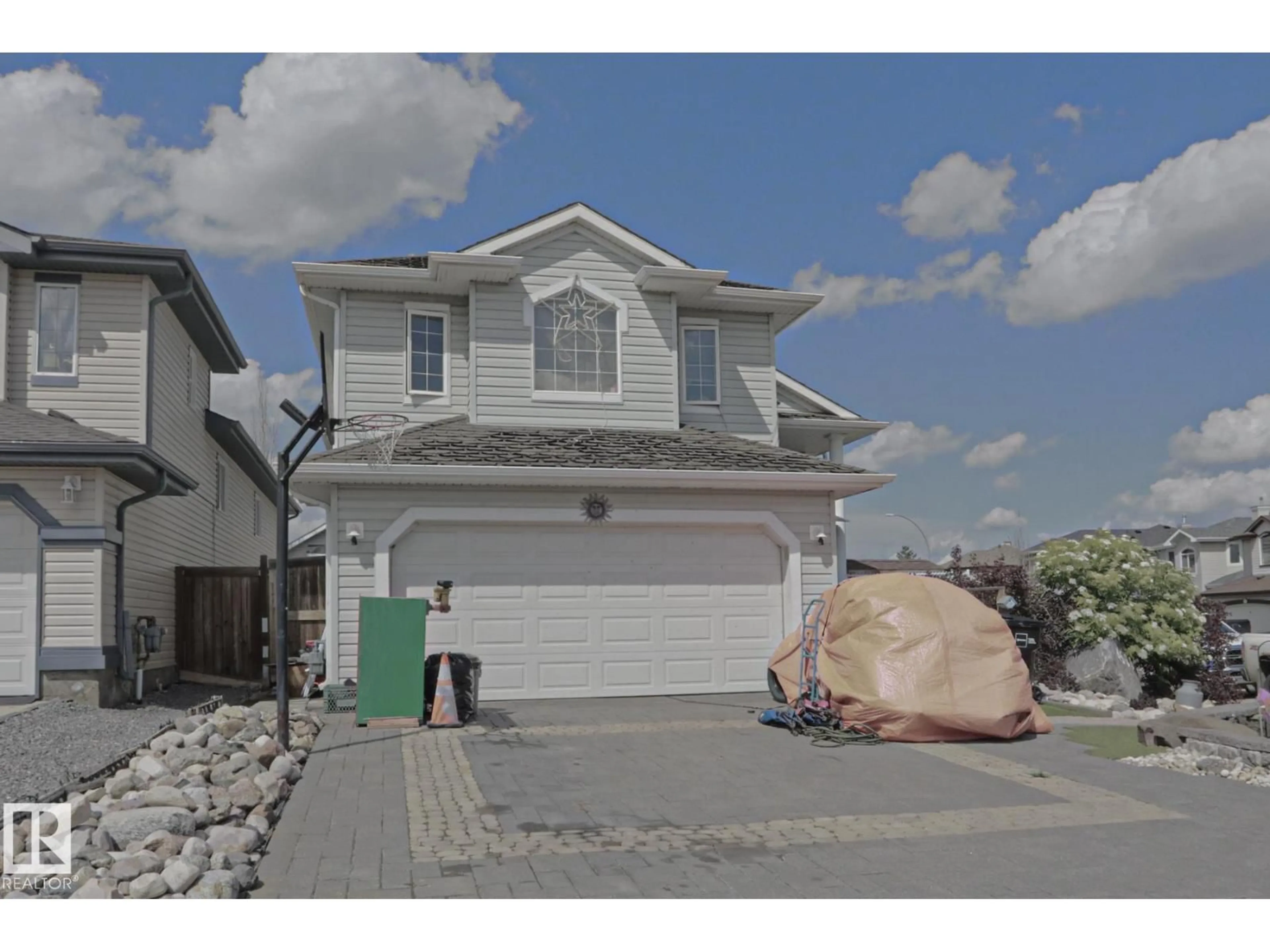 Home with vinyl exterior material, street for 4506 154 AV, Edmonton Alberta T5Y3H3