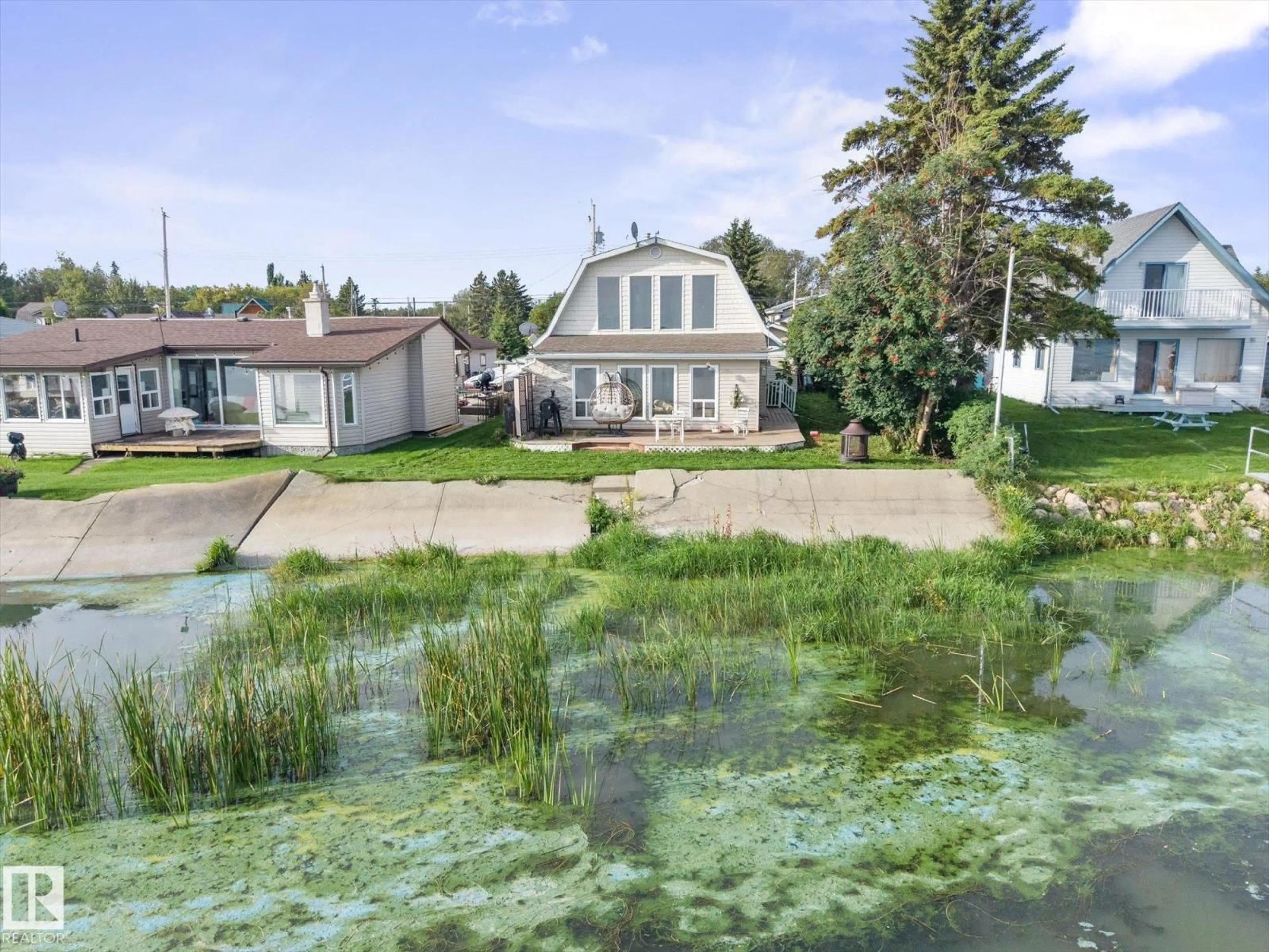 A pic from outside/outdoor area/front of a property/back of a property/a pic from drone, water/lake/river/ocean view for 6326 50 AV, Rural Lac Ste. Anne County Alberta T0E0A0
