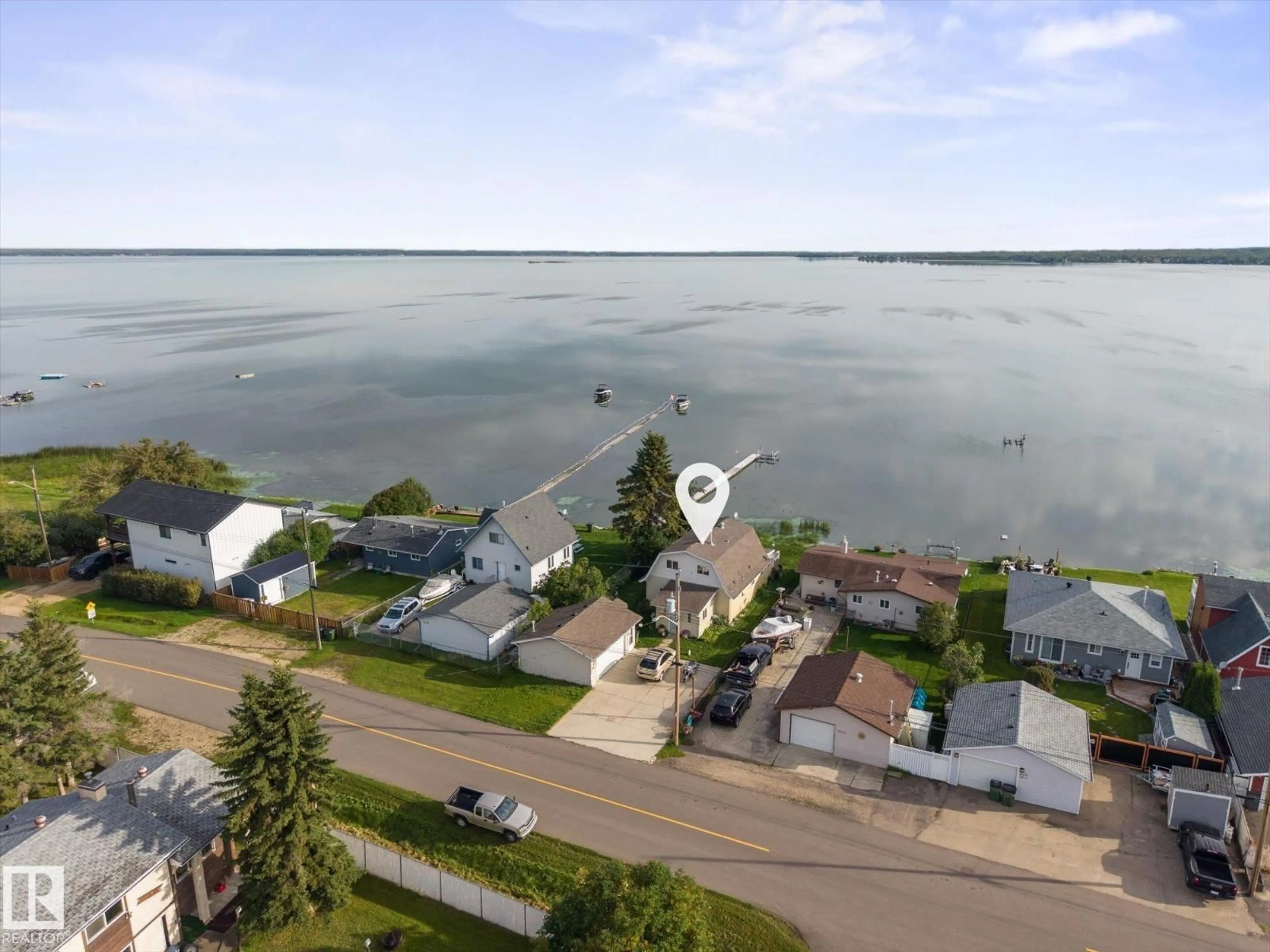 A pic from outside/outdoor area/front of a property/back of a property/a pic from drone, water/lake/river/ocean view for 6326 50 AV, Rural Lac Ste. Anne County Alberta T0E0A0