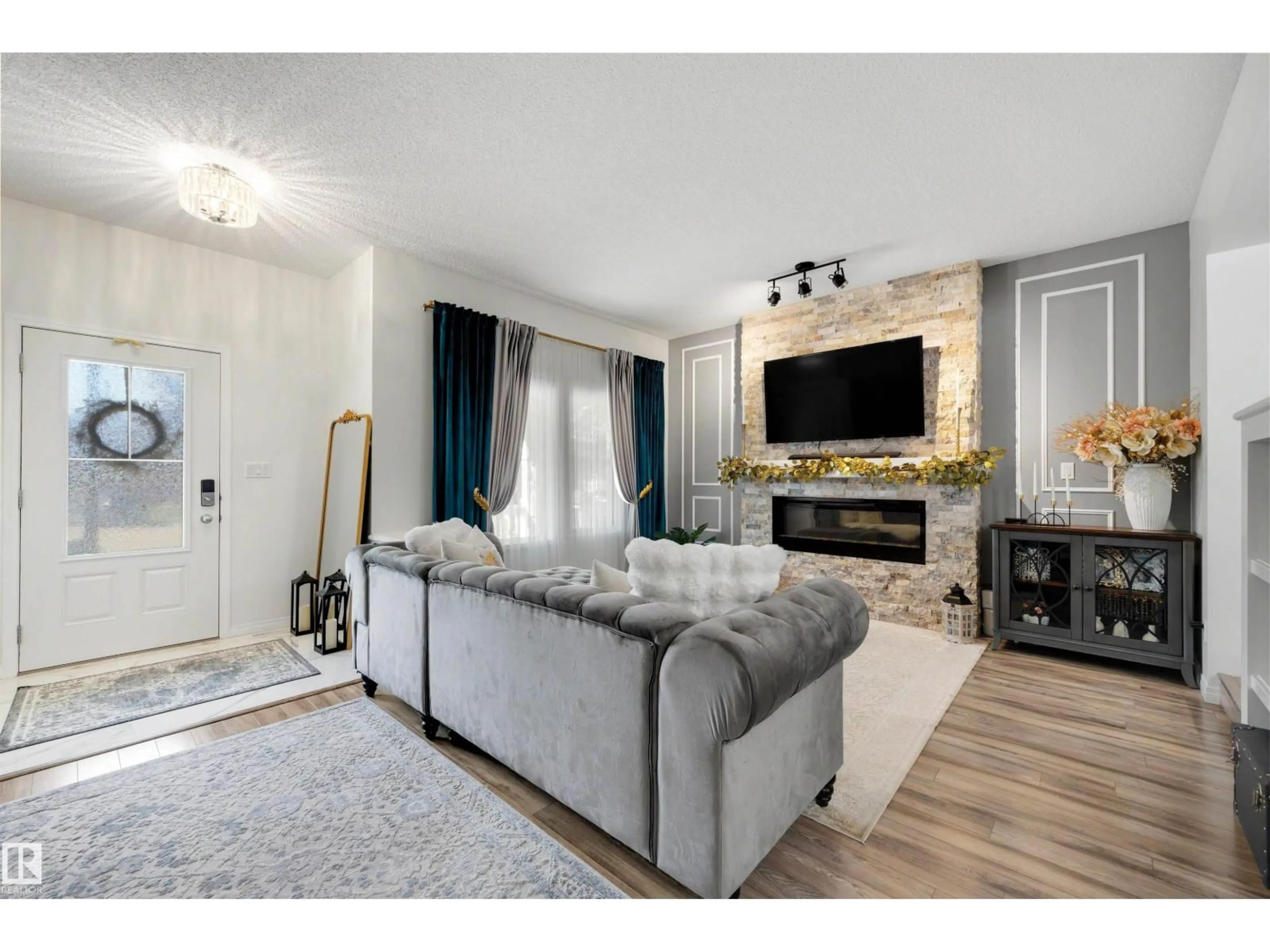 Living room with furniture, wood/laminate floor for 3231 CHERRY CR, Edmonton Alberta T6X1Y5