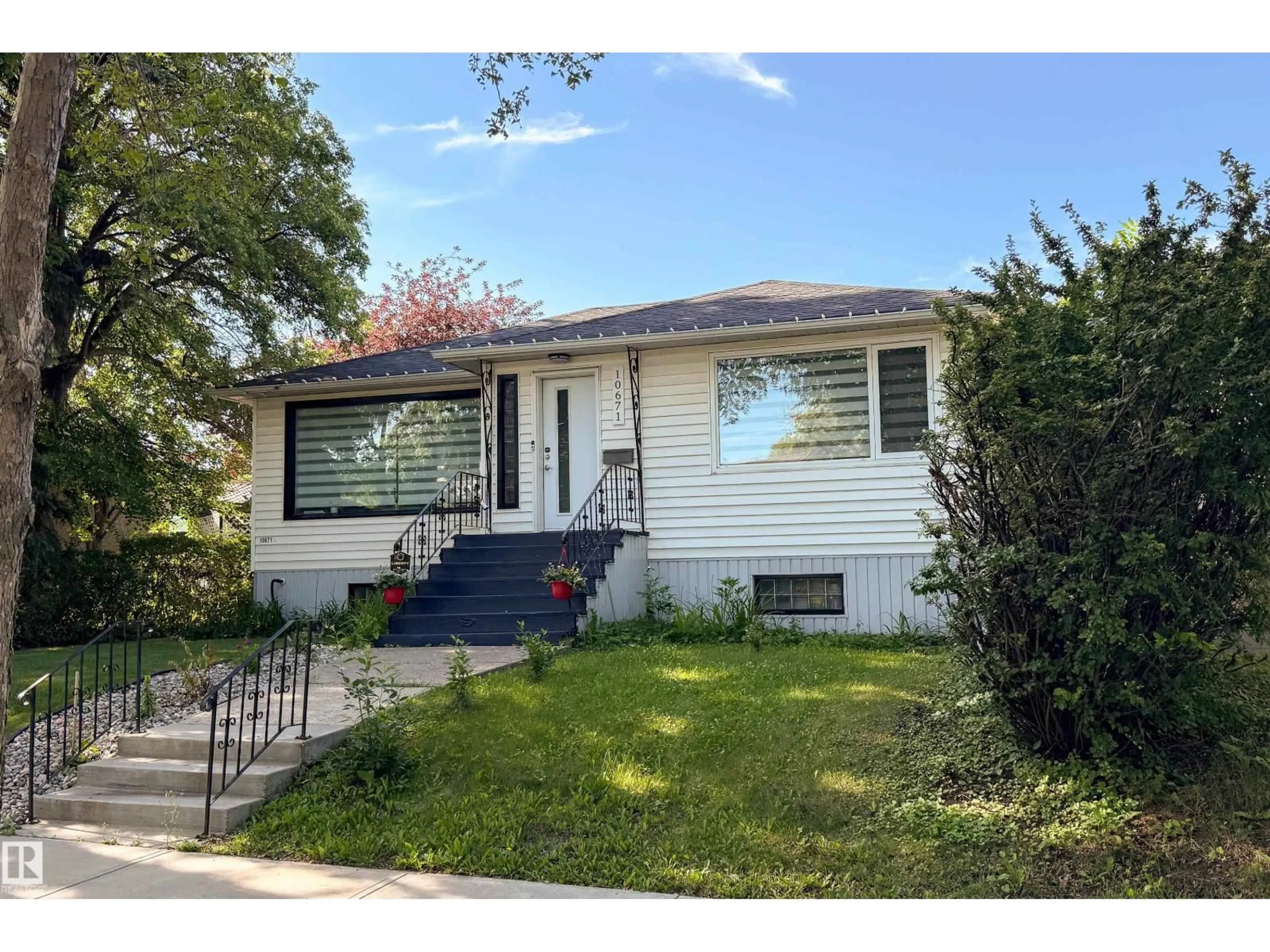 Home with vinyl exterior material, street for 10671 63 AV, Edmonton Alberta T6H1P7
