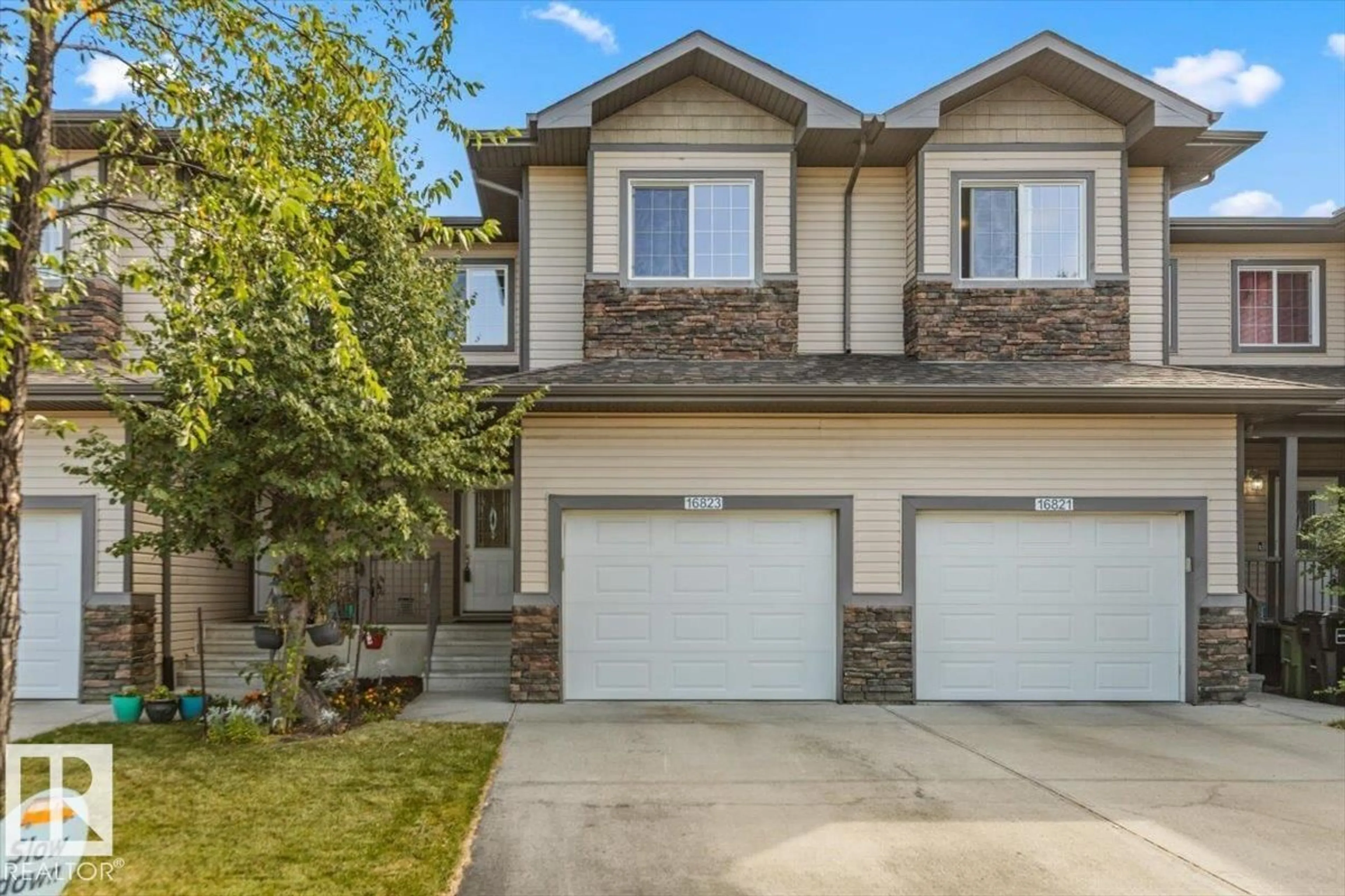 Home with vinyl exterior material, street for 16823 55 ST, Edmonton Alberta T5Y0R3
