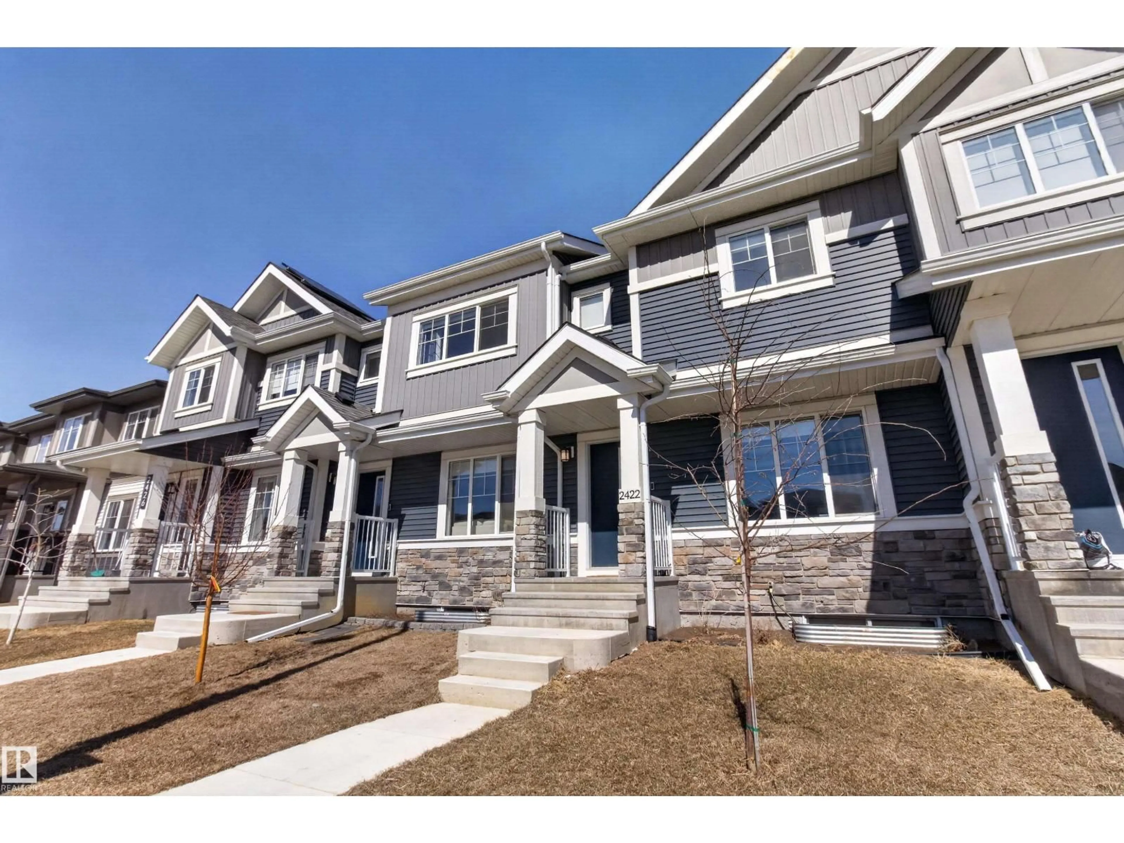Home with vinyl exterior material, street for 2422 TRUMPETER WY, Edmonton Alberta T5V1T8