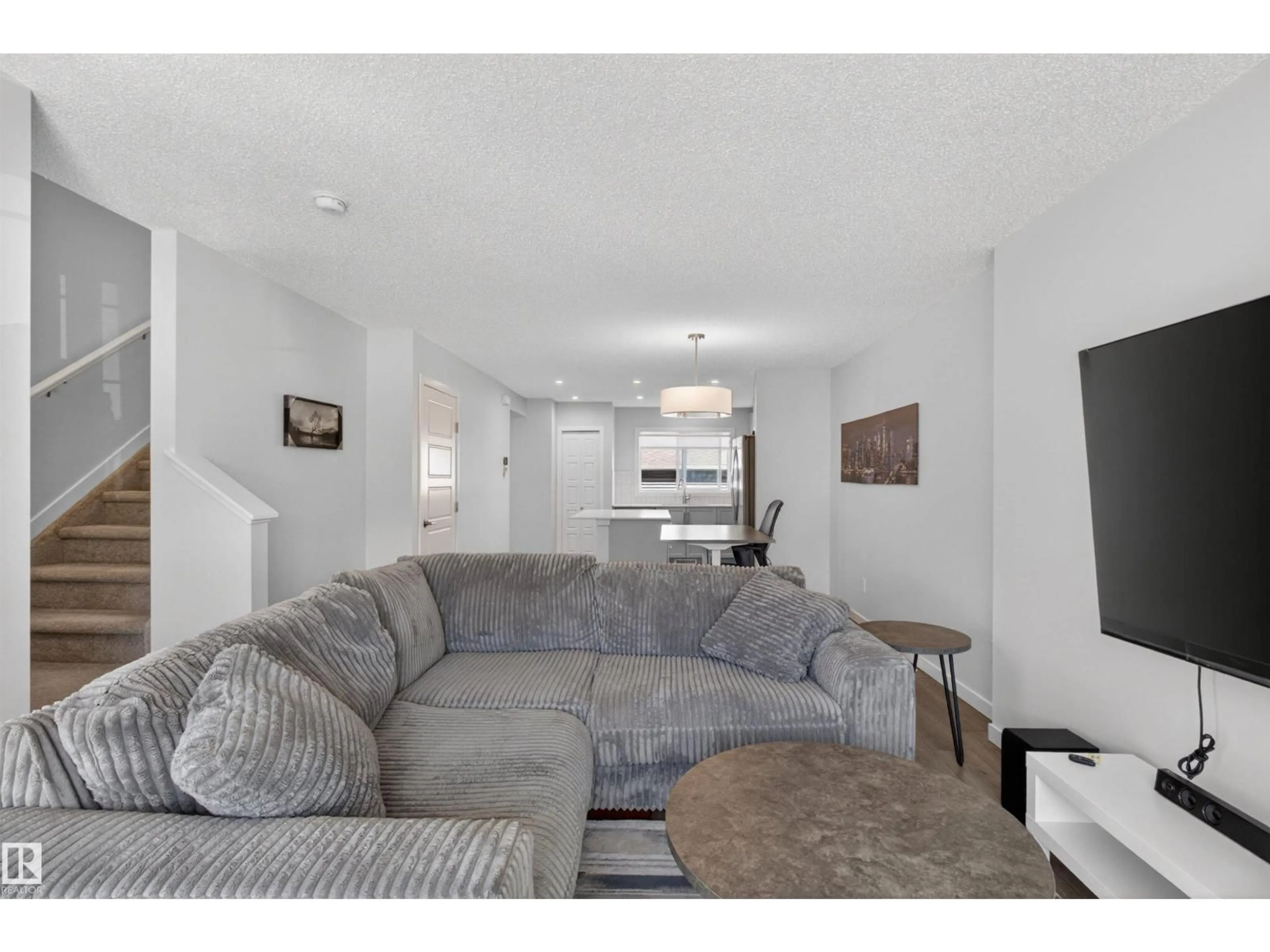 Living room with furniture, unknown for 2422 TRUMPETER WY, Edmonton Alberta T5V1T8