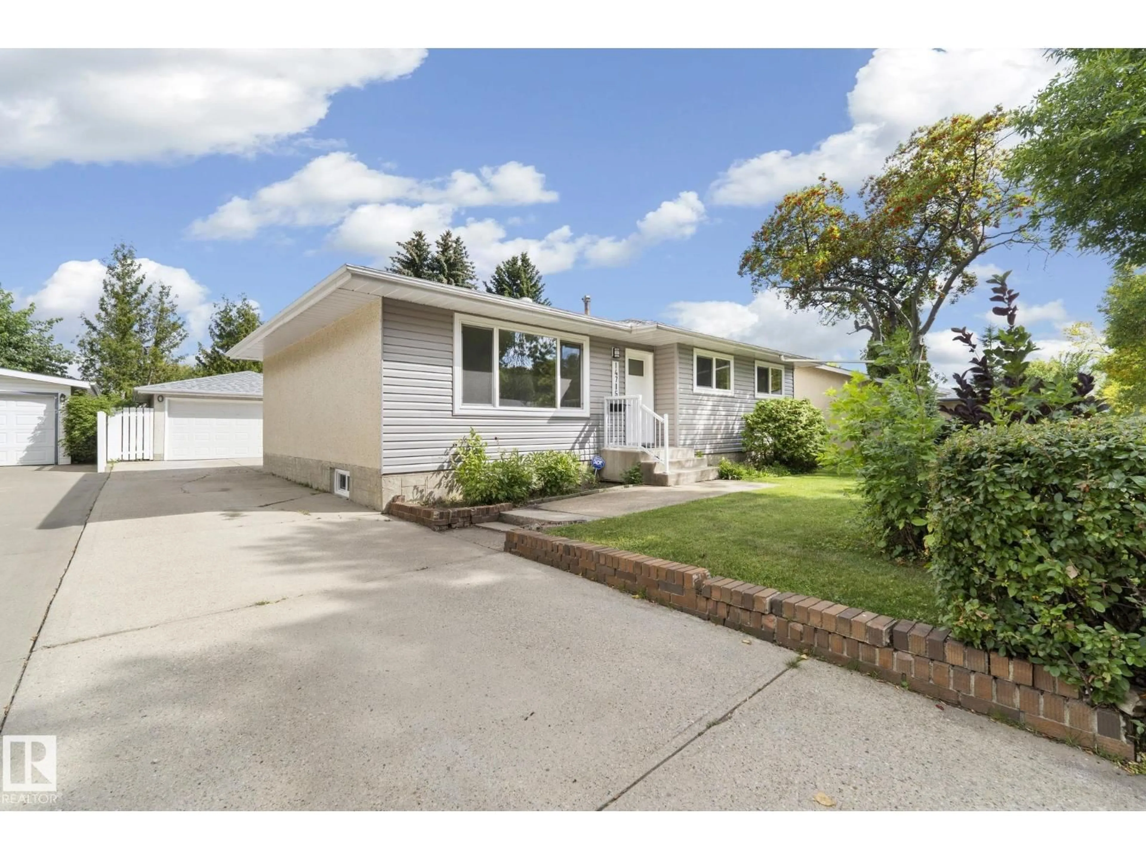 Home with vinyl exterior material, street for NW - 14715 62 ST, Edmonton Alberta T5A2A9