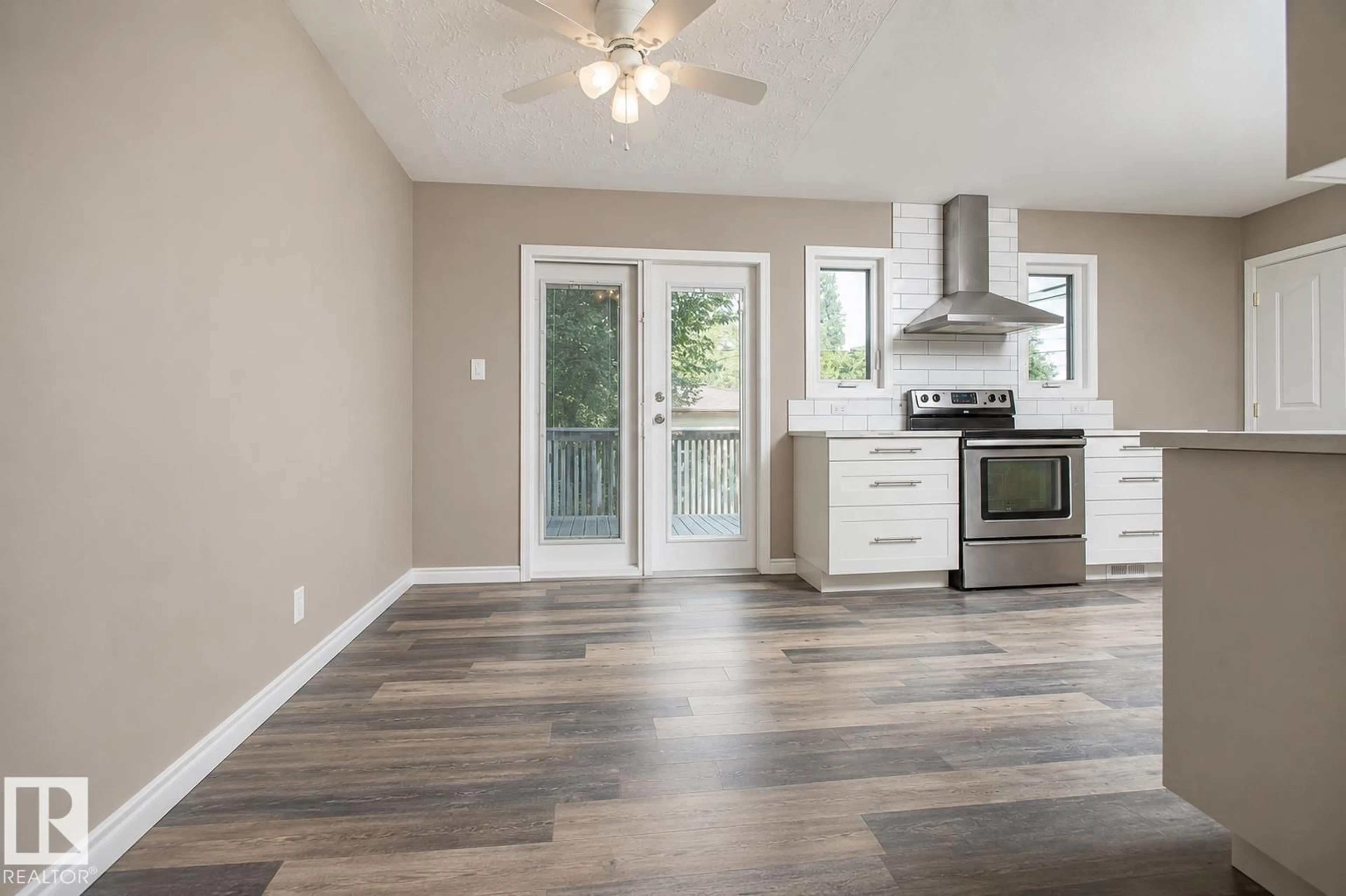 Open concept kitchen, wood/laminate floor for 9072 52 ST, Edmonton Alberta T6B1G2