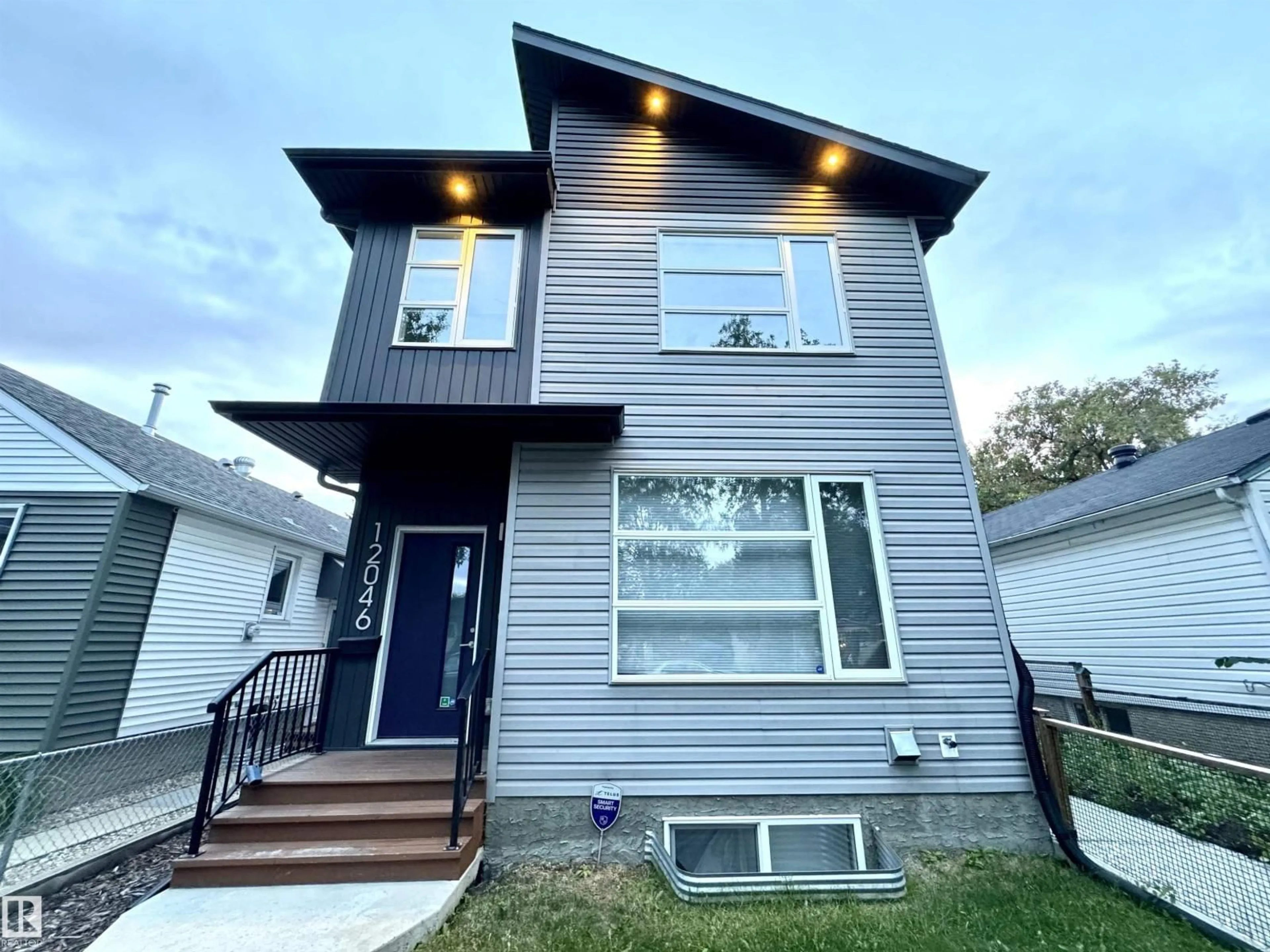 Home with vinyl exterior material, street for NW - 12046 89 ST, Edmonton Alberta T5B3W1