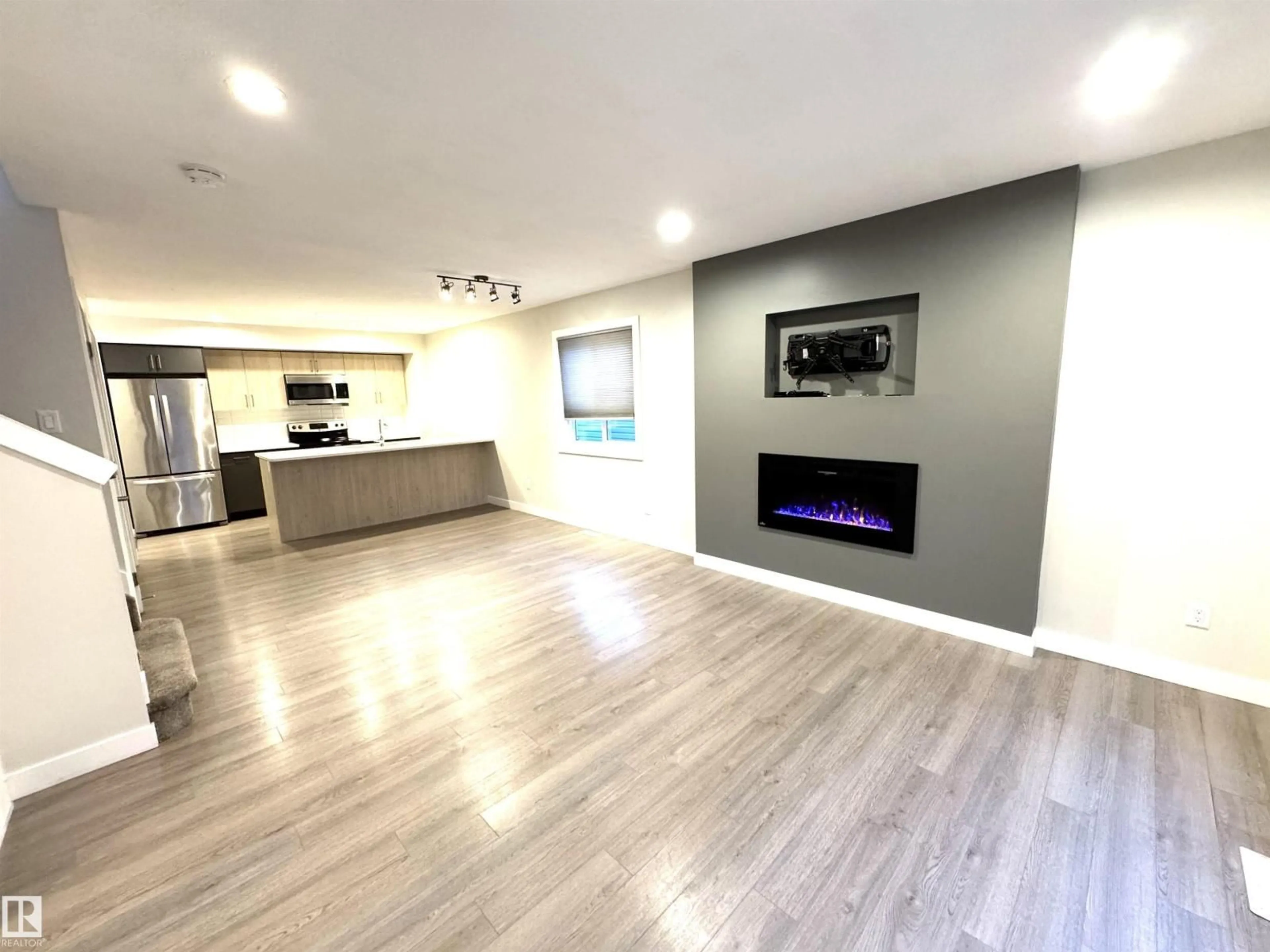 Open concept kitchen, wood/laminate floor for NW - 12046 89 ST, Edmonton Alberta T5B3W1