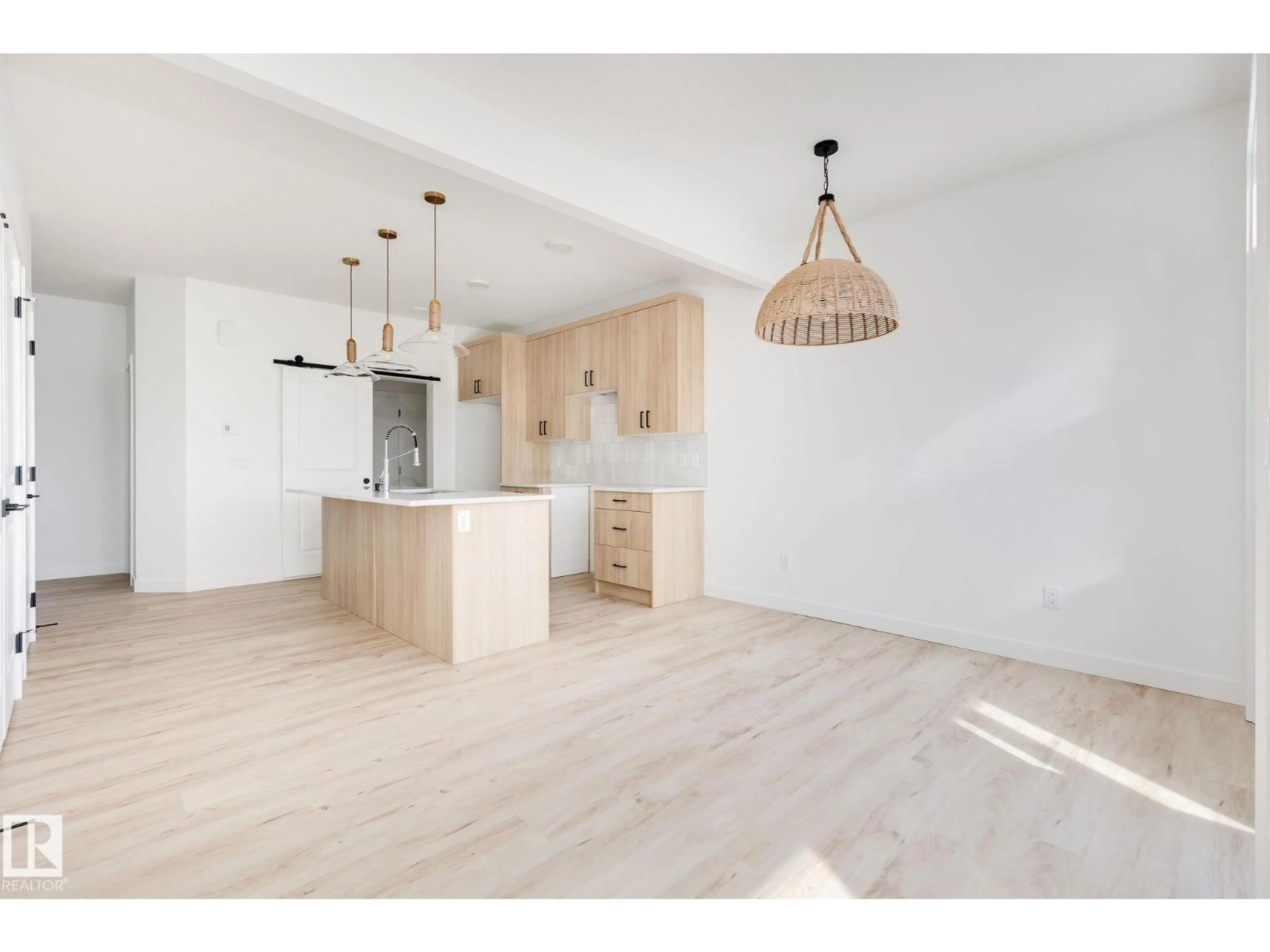 Open concept kitchen, wood/laminate floor for 8253 KIRIAK LO SW, Edmonton Alberta T6W5S2