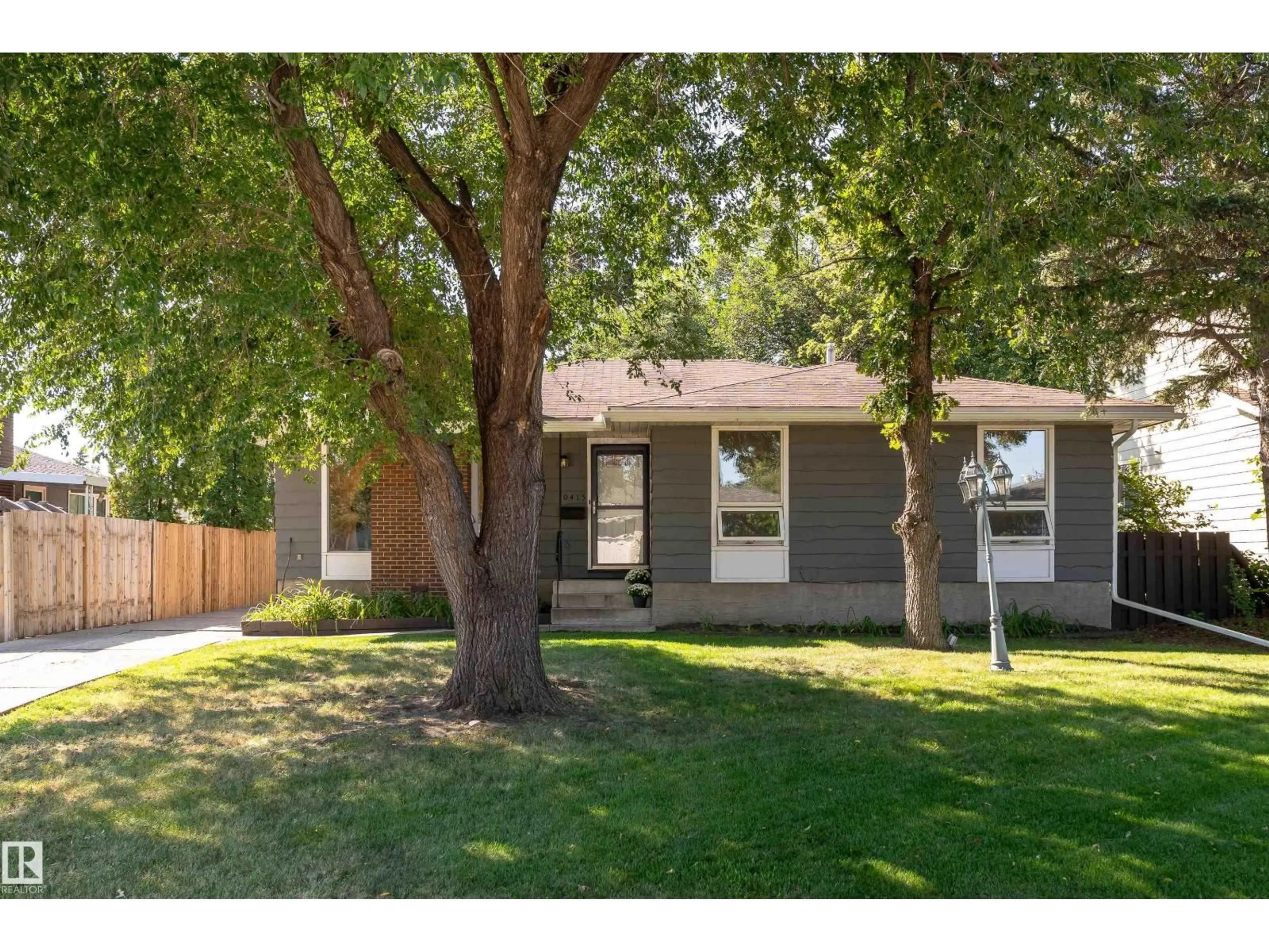 Home with vinyl exterior material, street for 10415 39A AV, Edmonton Alberta T6J2J5