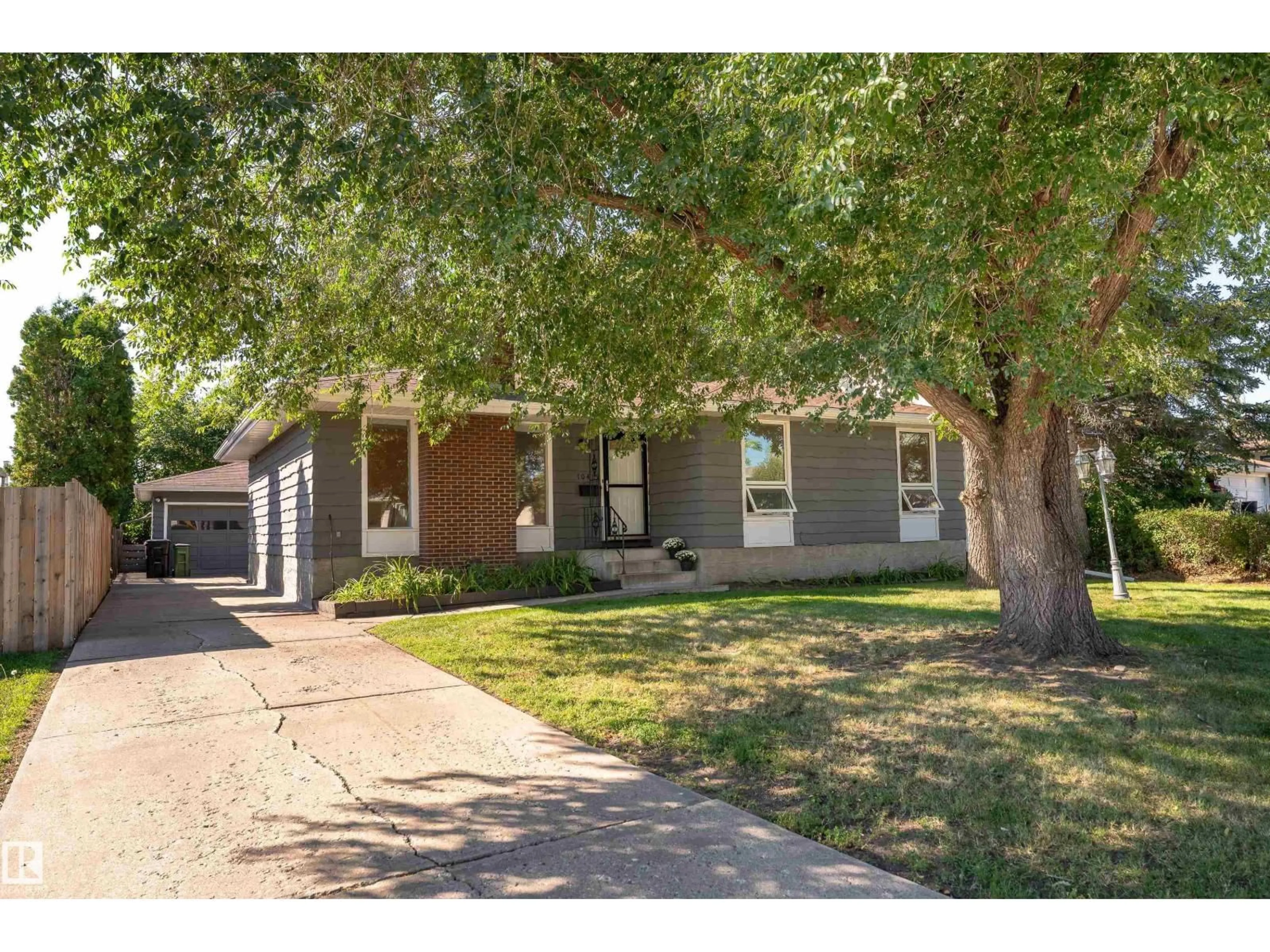 Home with brick exterior material, street for 10415 39A AV, Edmonton Alberta T6J2J5