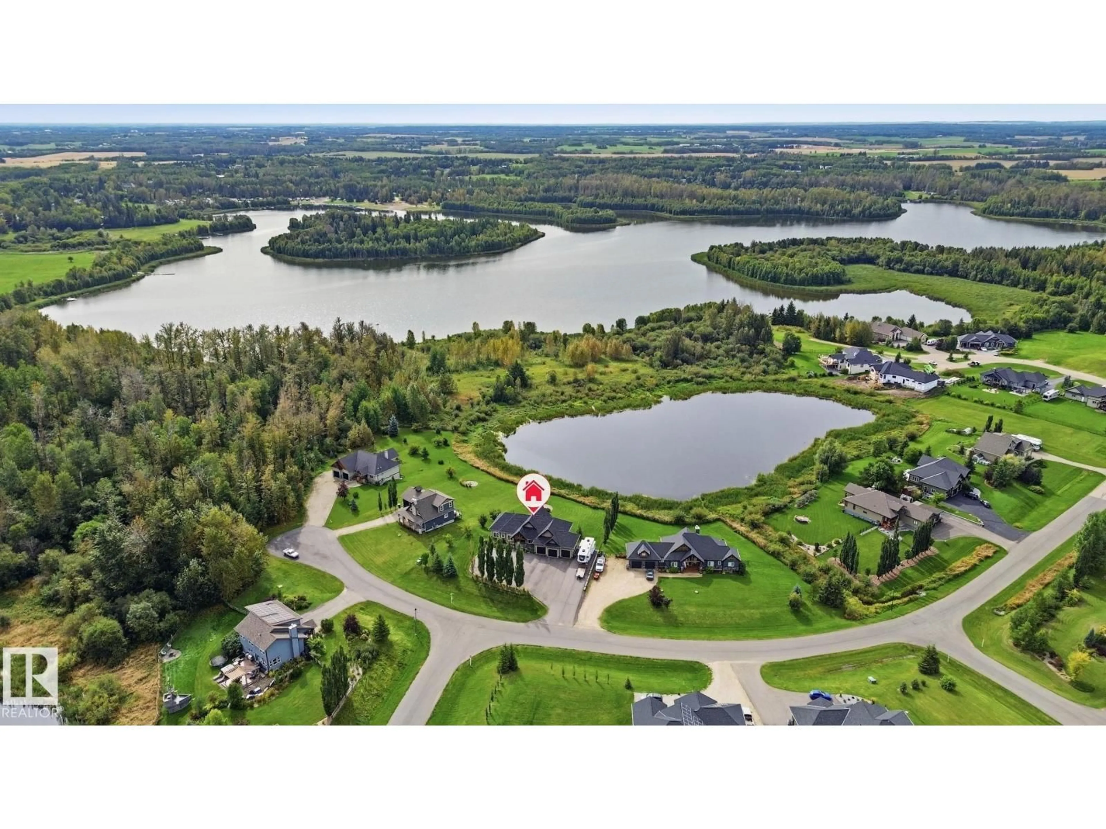 A pic from outside/outdoor area/front of a property/back of a property/a pic from drone, water/lake/river/ocean view for 2010 SPRING DR, Rural Parkland County Alberta T7Z1X2