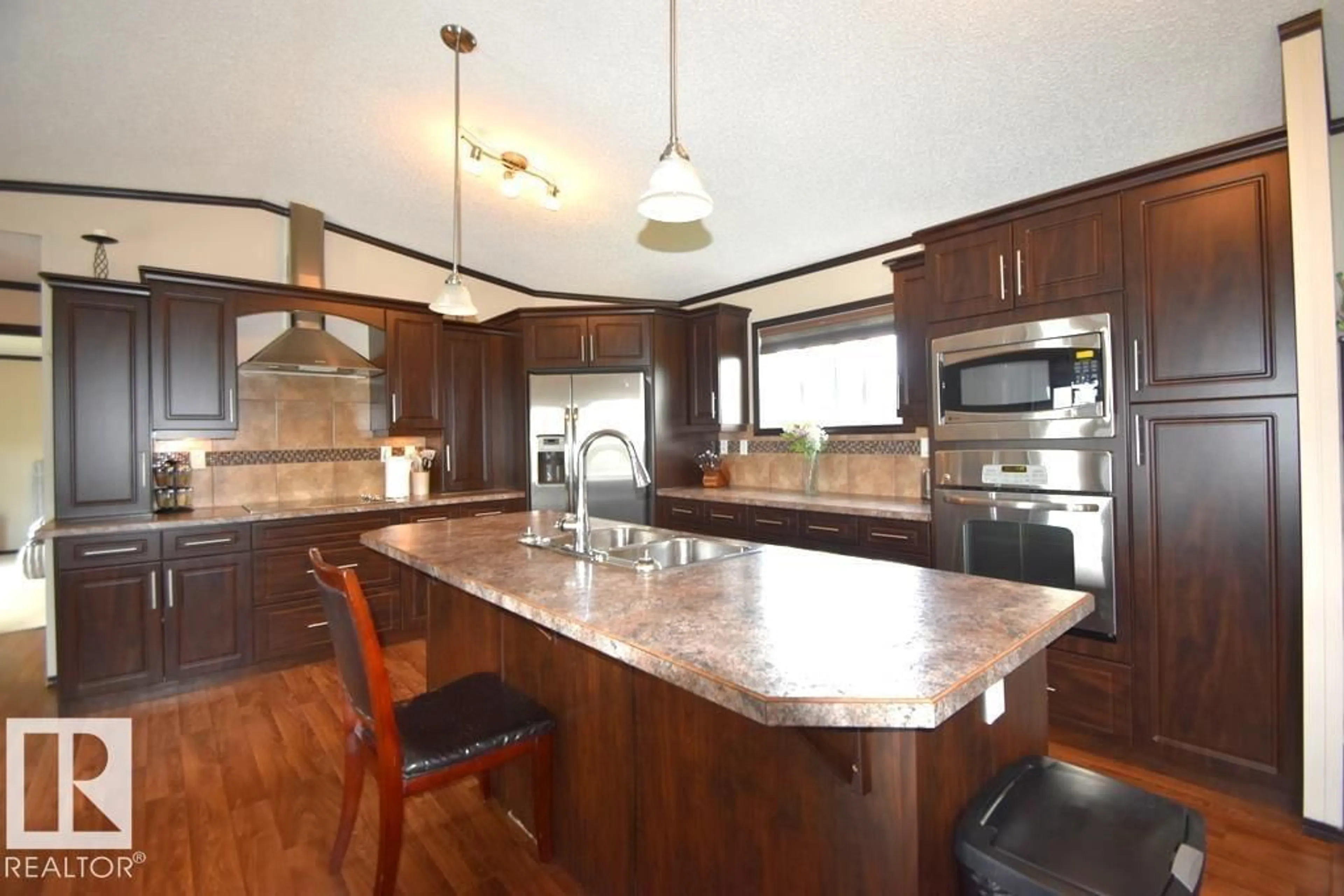 Open concept kitchen, wood/laminate floor for 6540333 - 5 RGE RD 190, Rural Athabasca County Alberta T0A0M0