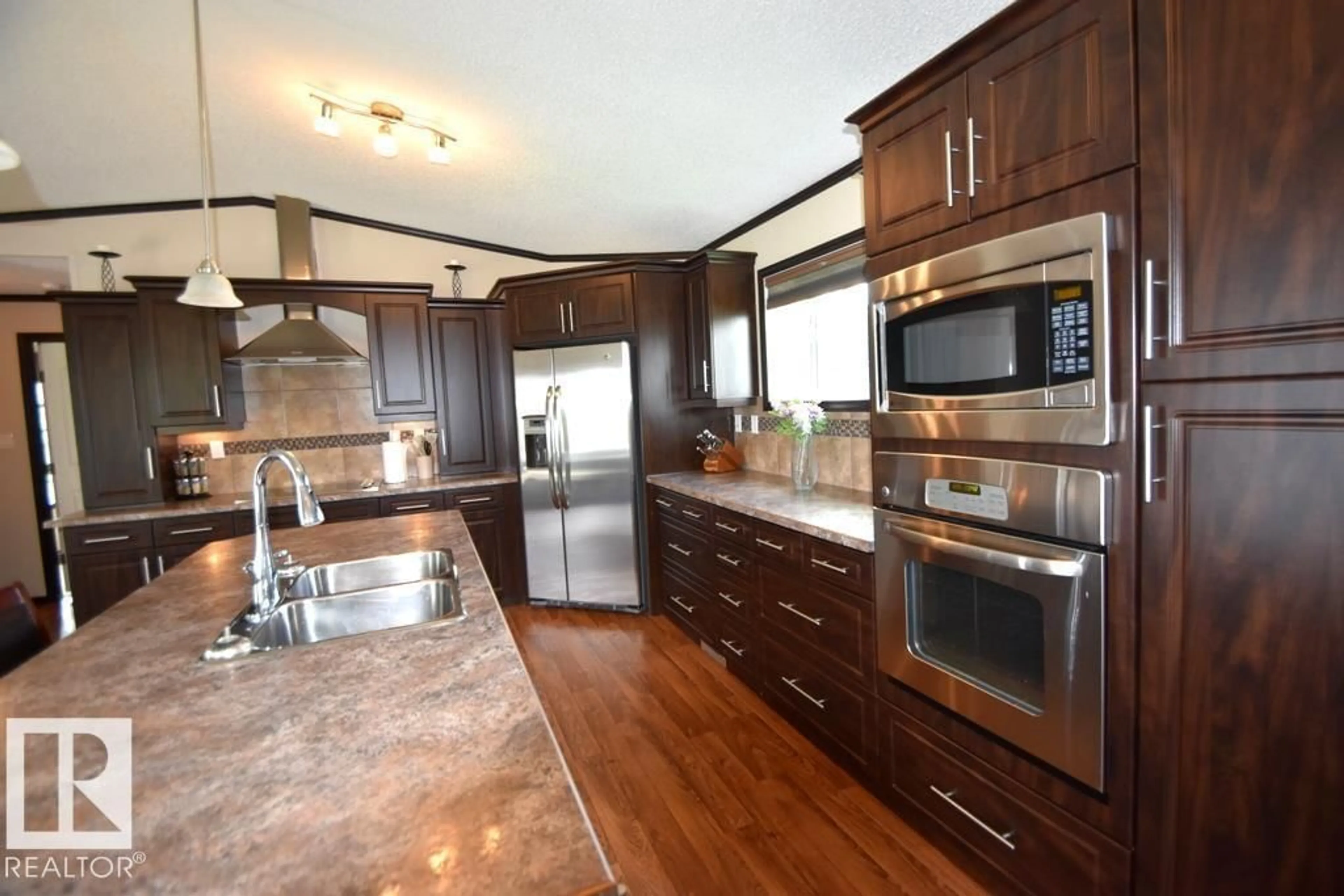 Open concept kitchen, wood/laminate floor for 6540333 - 5 RGE RD 190, Rural Athabasca County Alberta T0A0M0