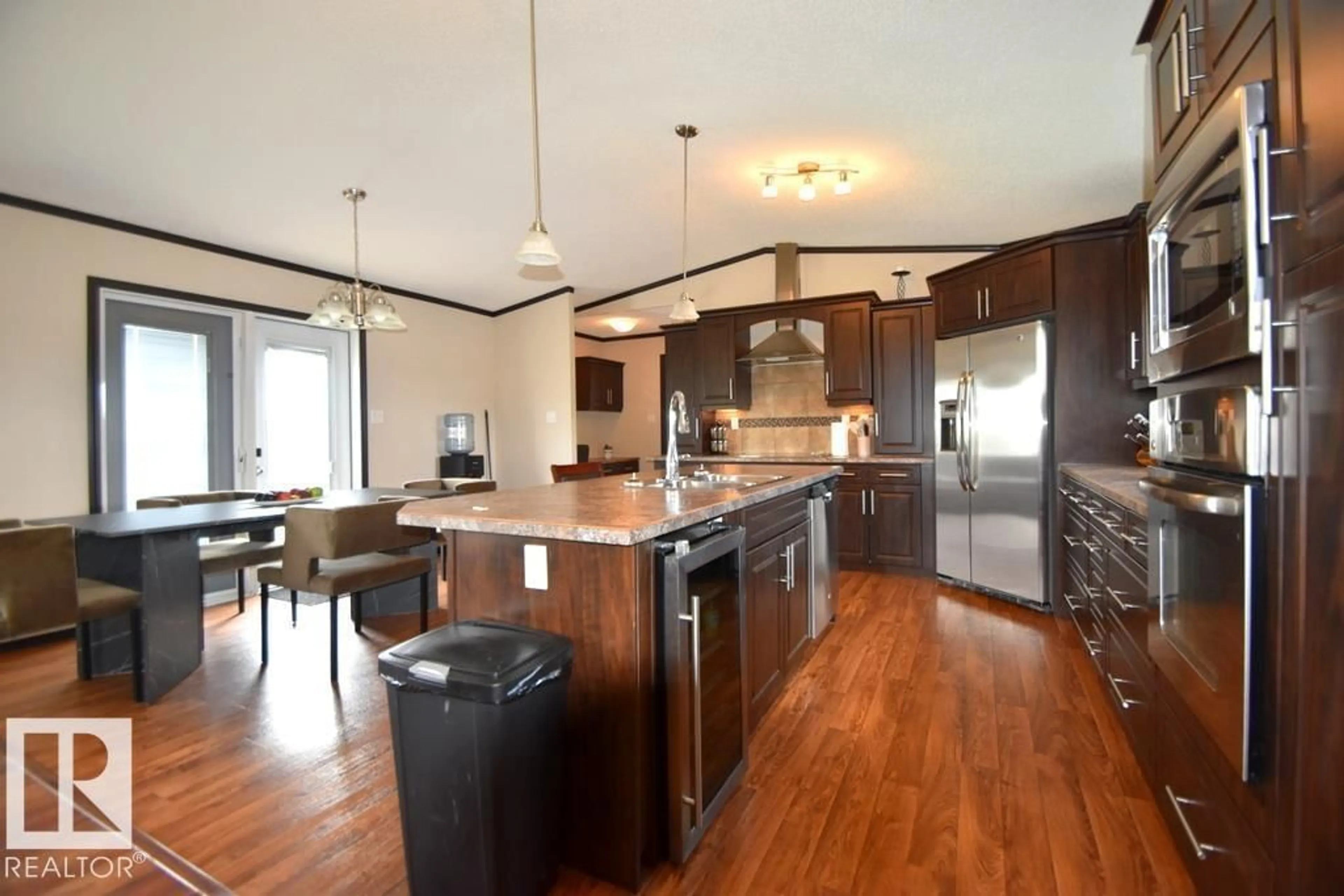 Open concept kitchen, wood/laminate floor for 6540333 - 5 RGE RD 190, Rural Athabasca County Alberta T0A0M0