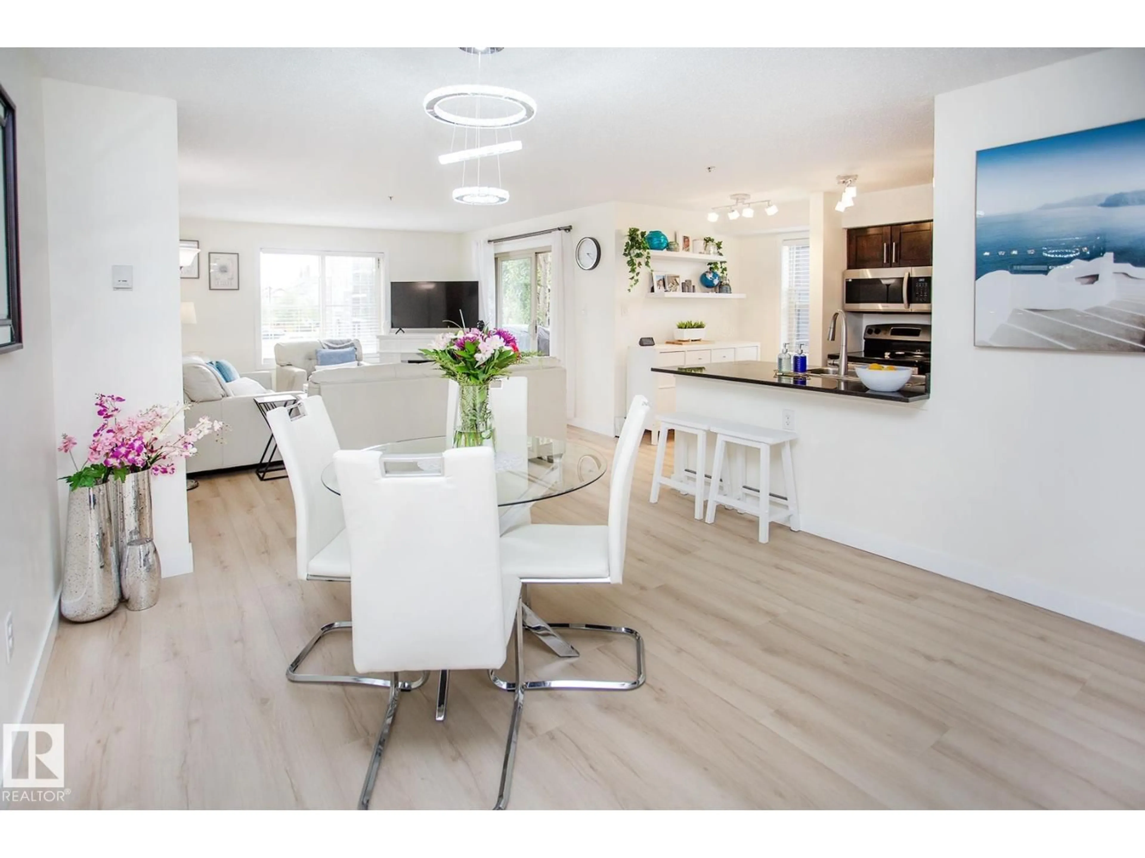 Open concept kitchen, wood/laminate floor for 201 - 1070 MCCONACHIE BV, Edmonton Alberta T5Y0X1
