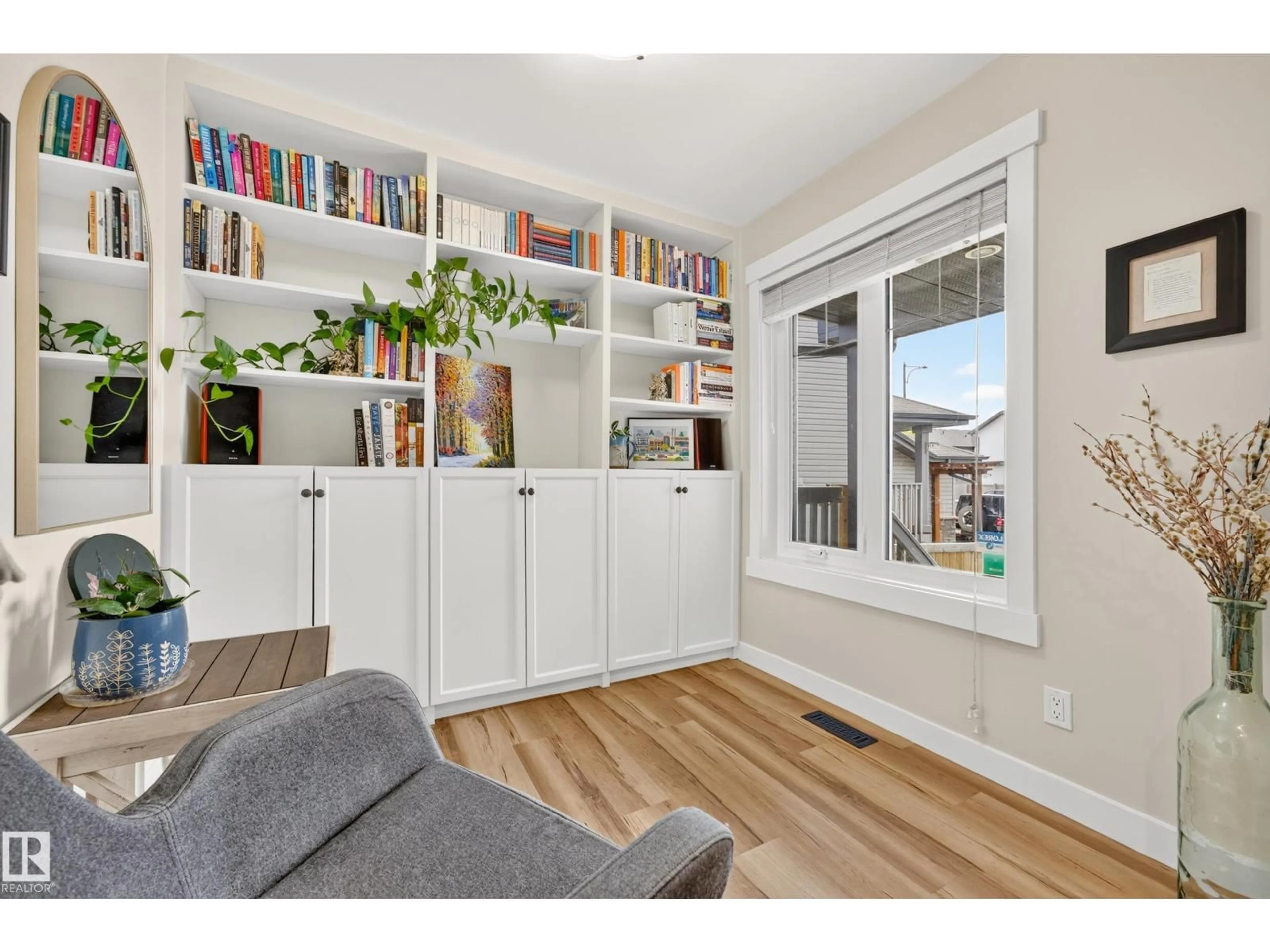 Living room with furniture, wood/laminate floor for 12528 172 AV, Edmonton Alberta T5X0E6