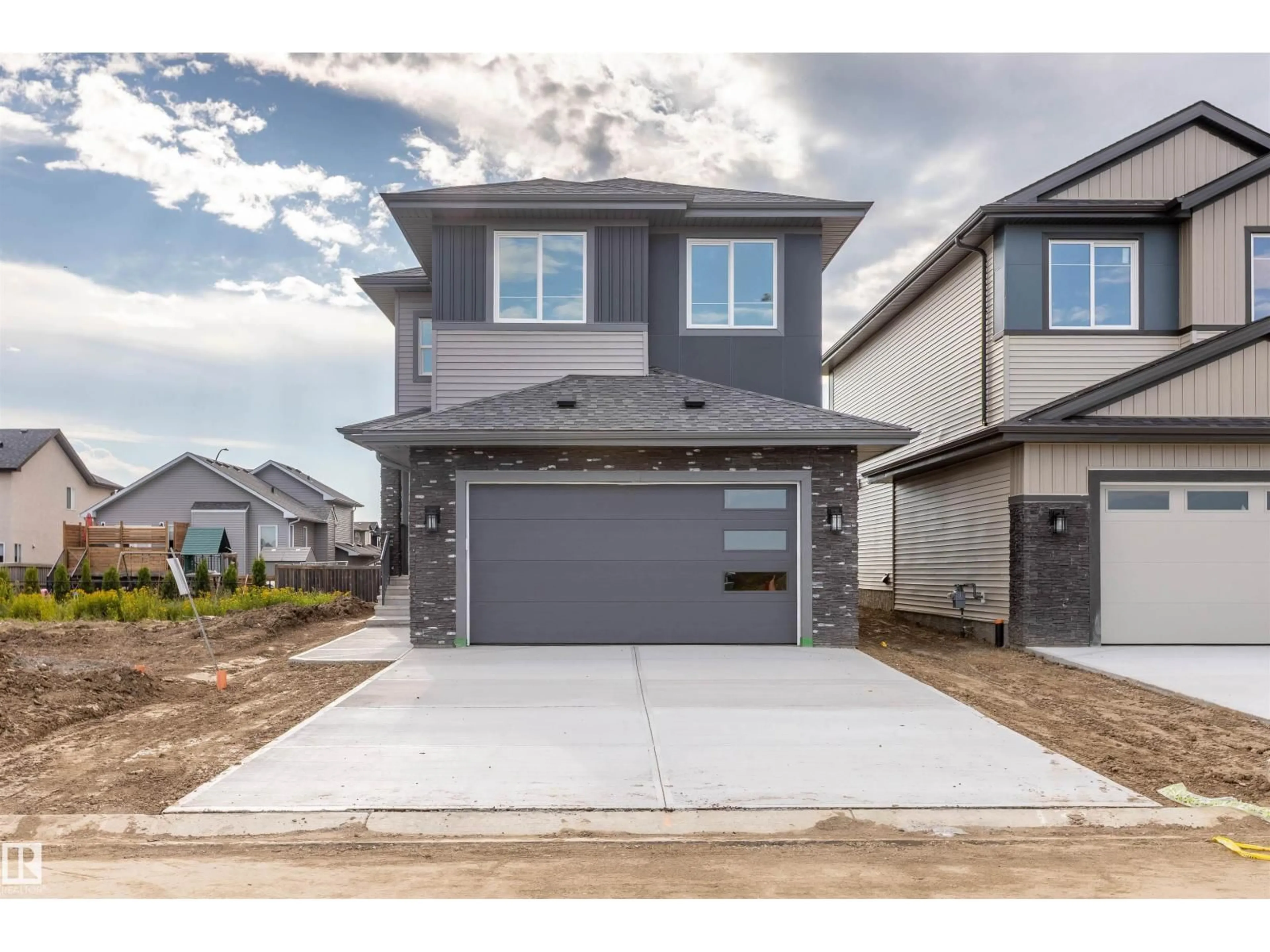 Home with brick exterior material, street for 10458 104 ST, Morinville Alberta T8R0C9