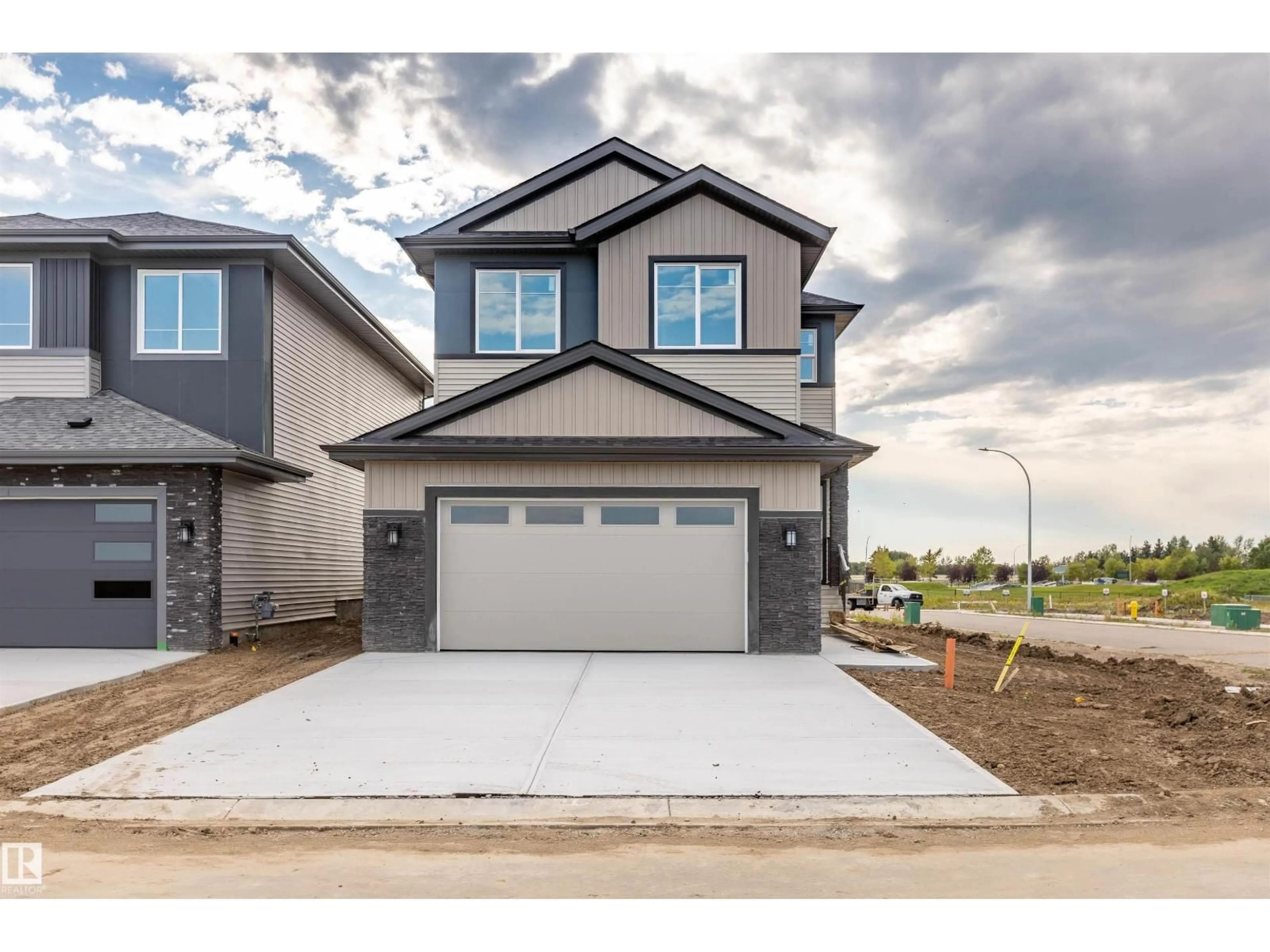 Home with vinyl exterior material, street for 10462 104 ST, Morinville Alberta T8R0C9