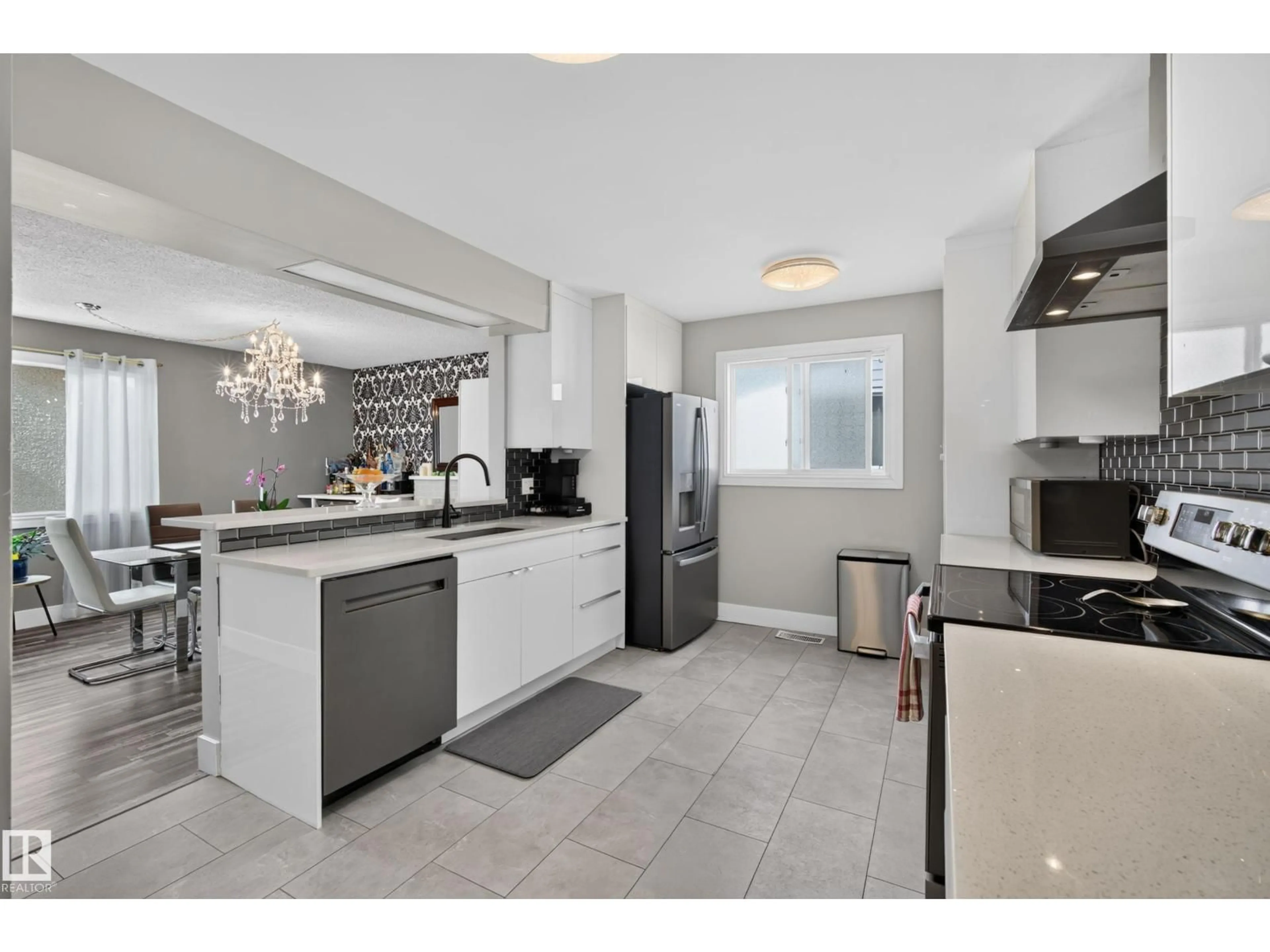Open concept kitchen, ceramic/tile floor for 13512 111 ST, Edmonton Alberta T5E4Z8