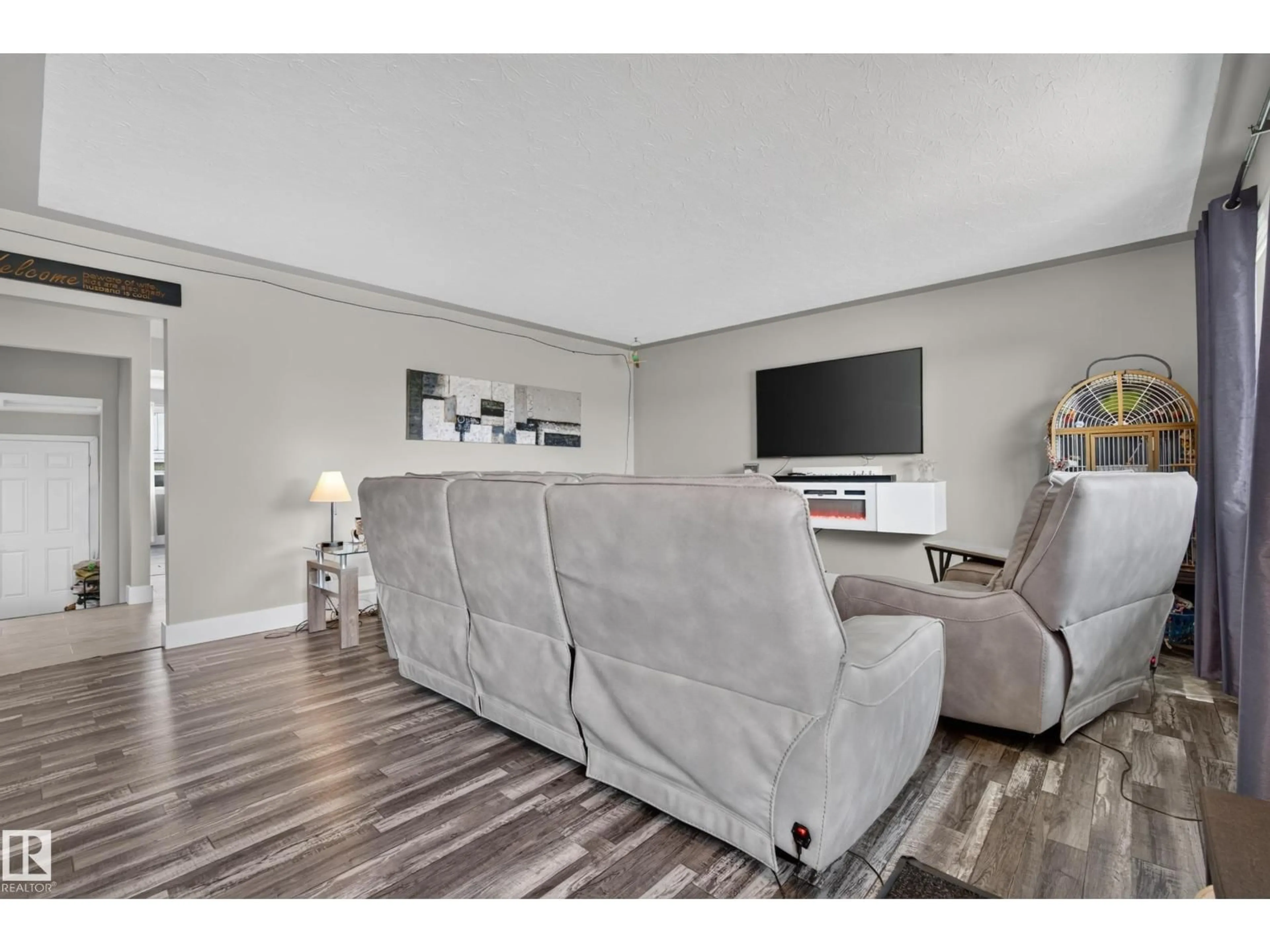 Living room with furniture, wood/laminate floor for 13512 111 ST, Edmonton Alberta T5E4Z8