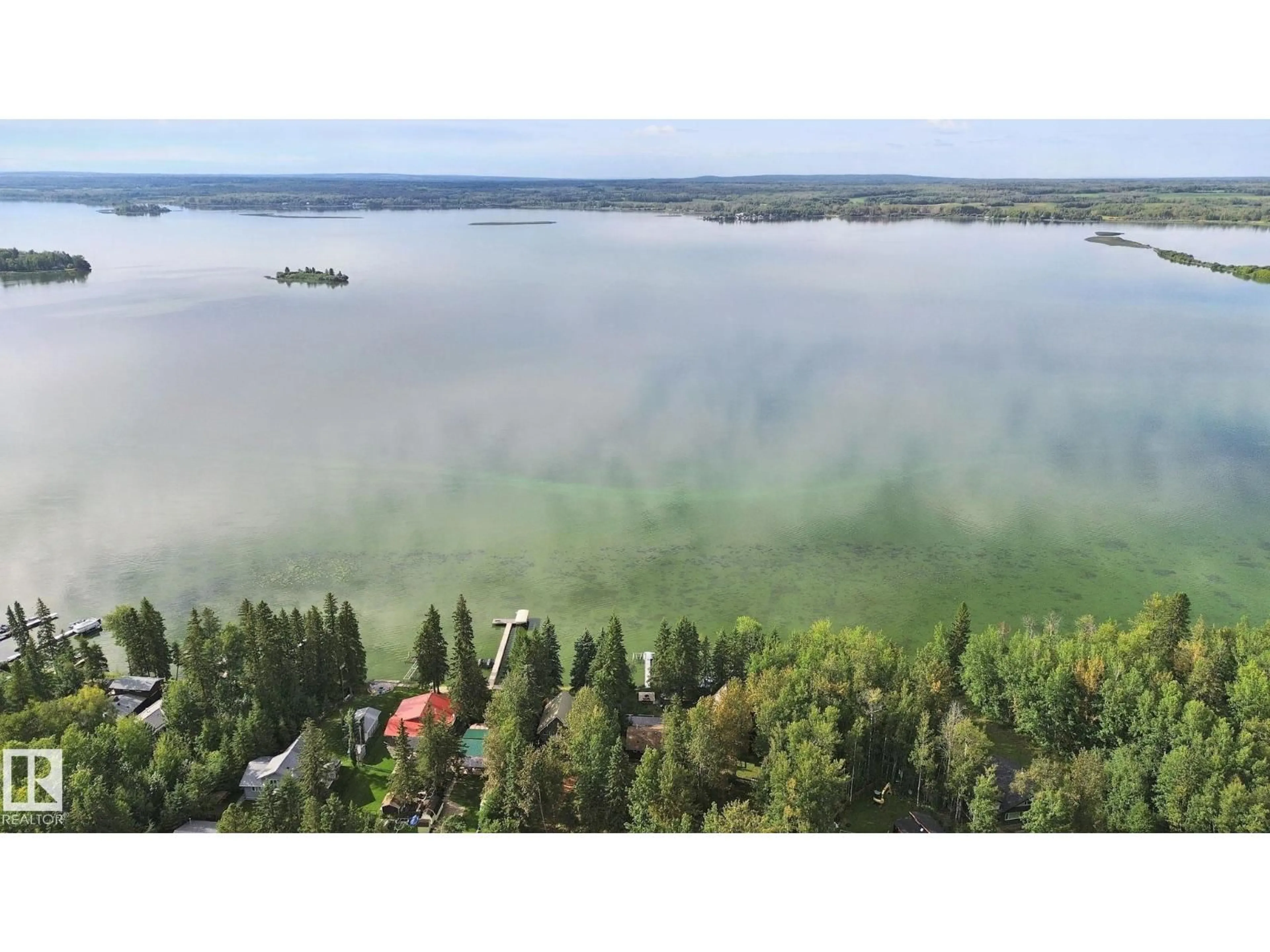 A pic from outside/outdoor area/front of a property/back of a property/a pic from drone, water/lake/river/ocean view for 15 CEDAR AV, Rural Lac Ste. Anne County Alberta T0E0V0