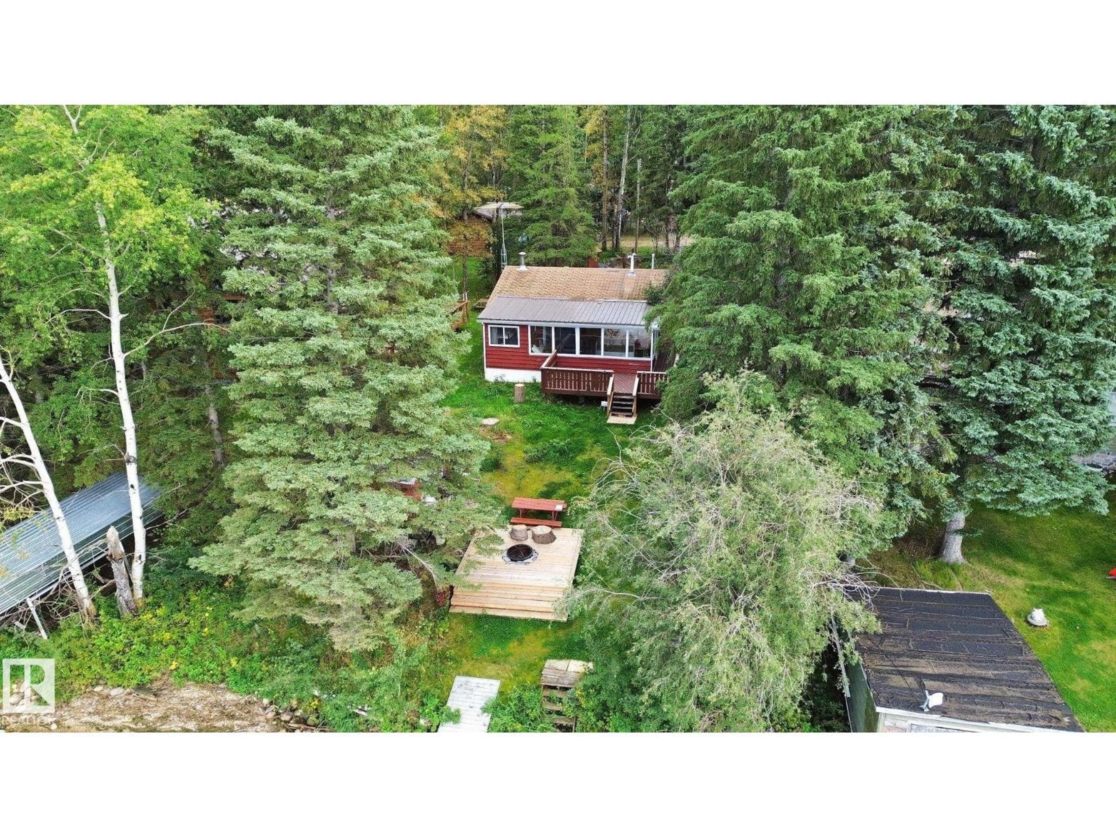 A pic from outside/outdoor area/front of a property/back of a property/a pic from drone, forest/trees view for 15 CEDAR AV, Rural Lac Ste. Anne County Alberta T0E0V0