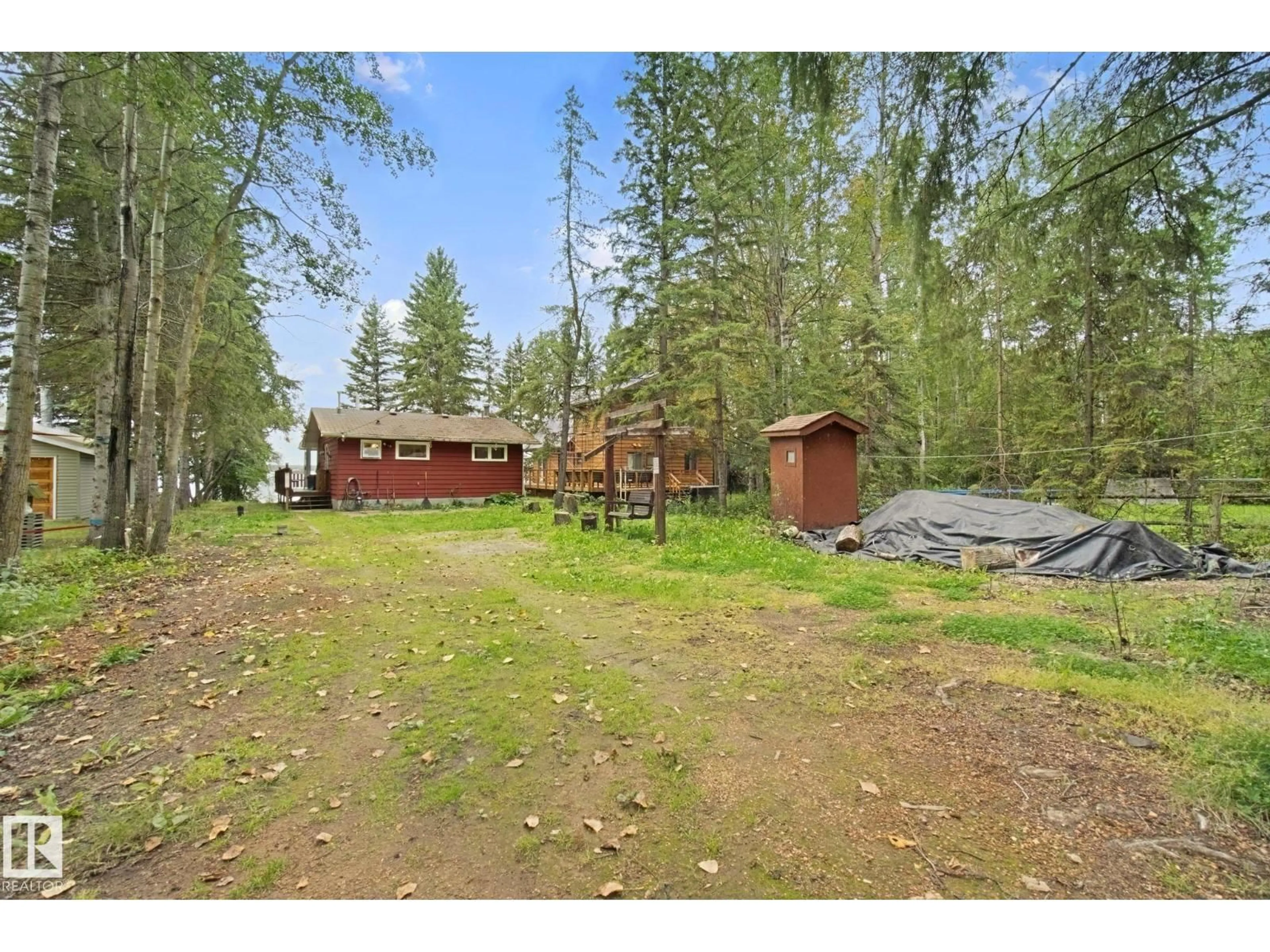 A pic from outside/outdoor area/front of a property/back of a property/a pic from drone, forest/trees view for 15 CEDAR AV, Rural Lac Ste. Anne County Alberta T0E0V0
