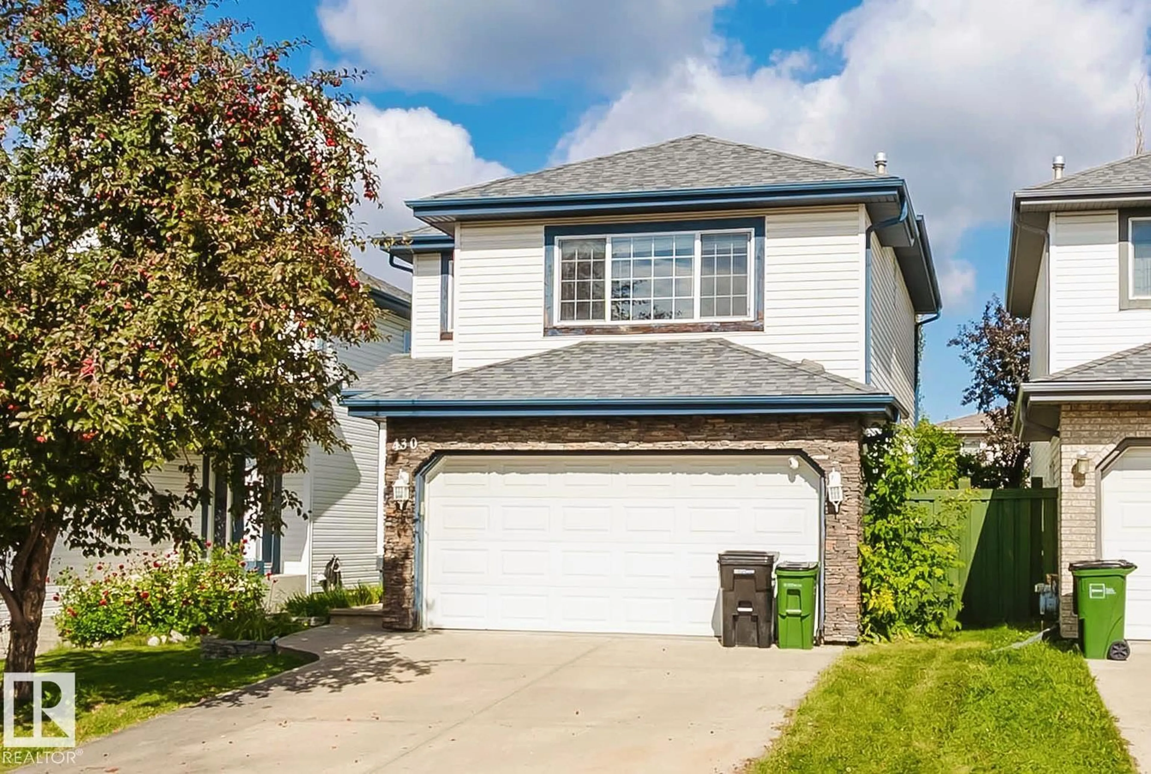 Home with vinyl exterior material, street for 430 HUNTERS GREEN GR, Edmonton Alberta T6R3C1
