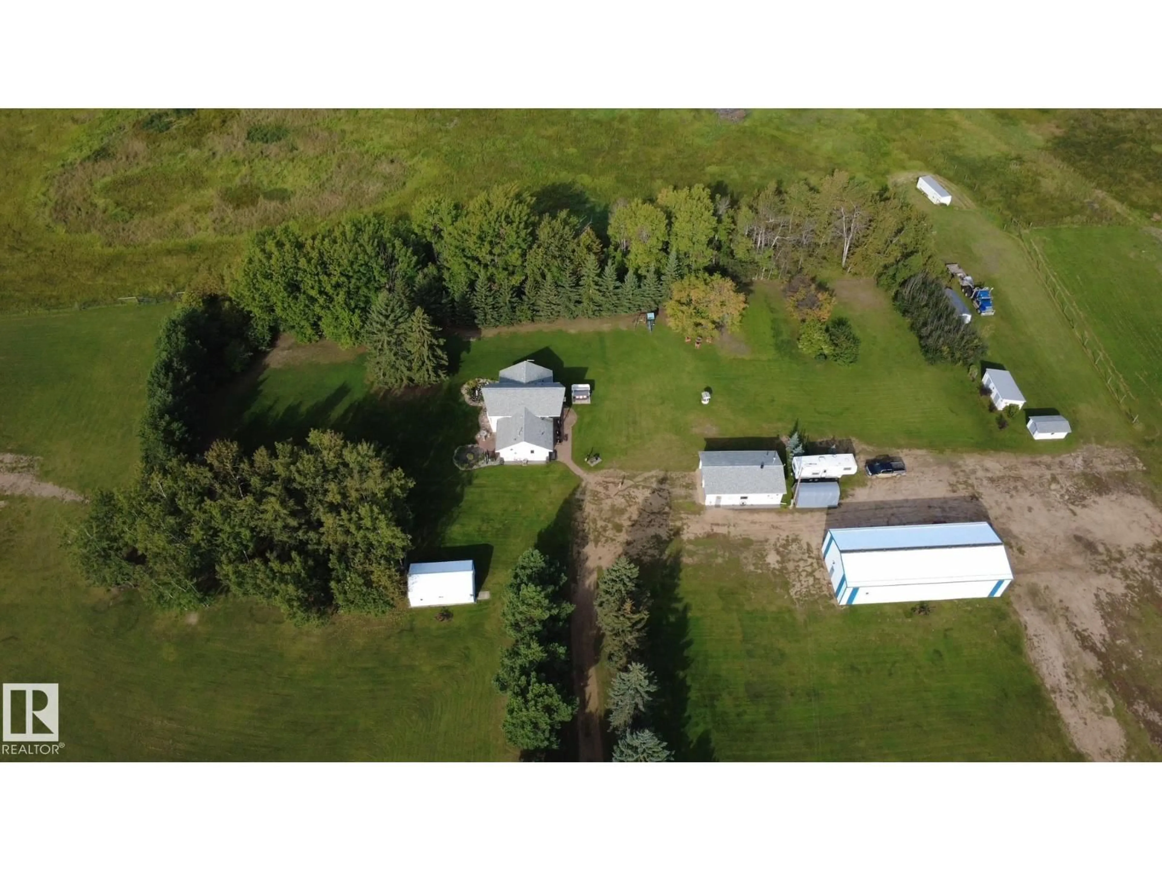 A pic from outside/outdoor area/front of a property/back of a property/a pic from drone, building for 661060 RANGE ROAD 210A, Rural Athabasca County Alberta T9S2B7