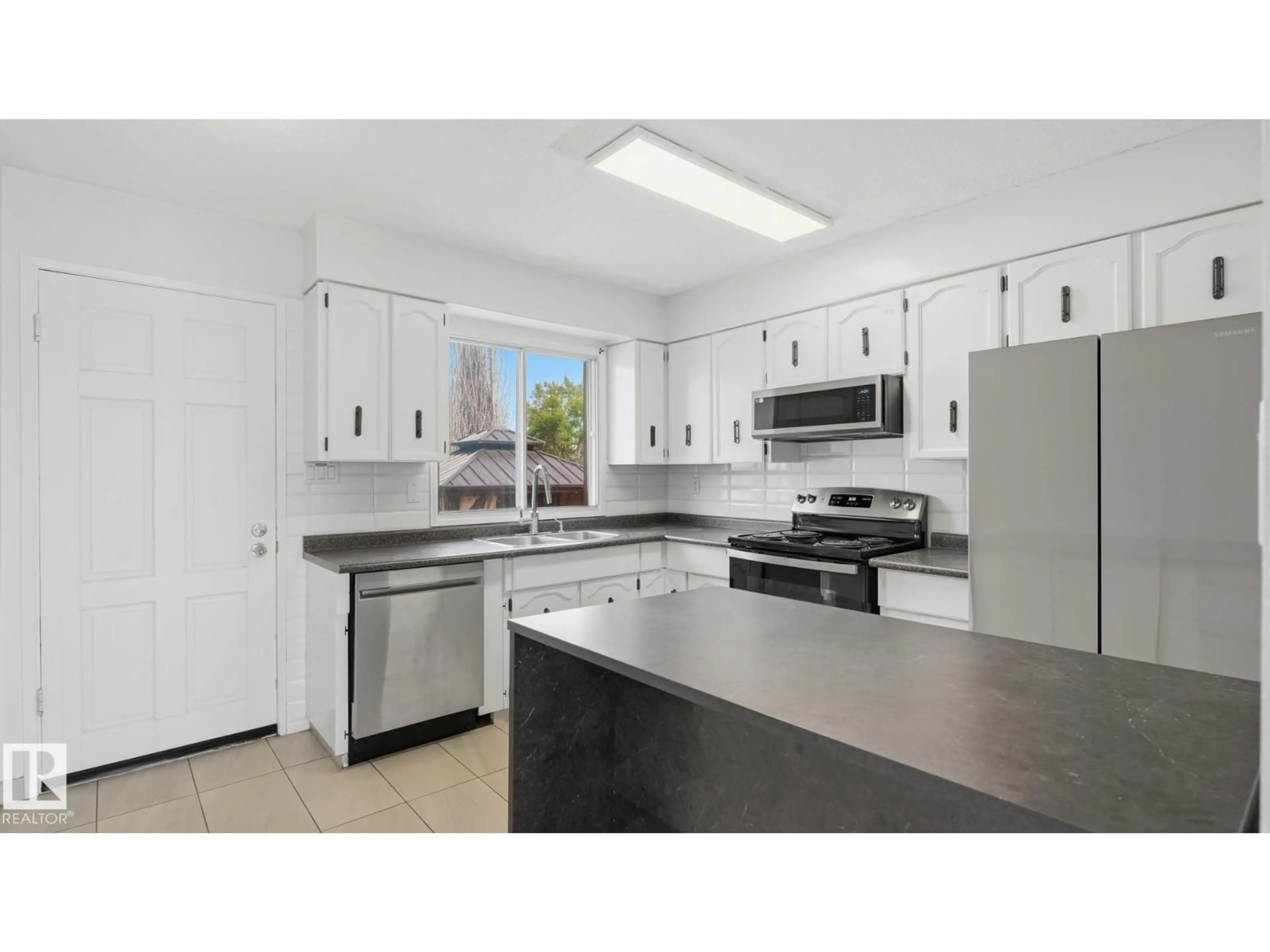 Standard kitchen, ceramic/tile floor for 12208 146 AV, Edmonton Alberta T5X4X6