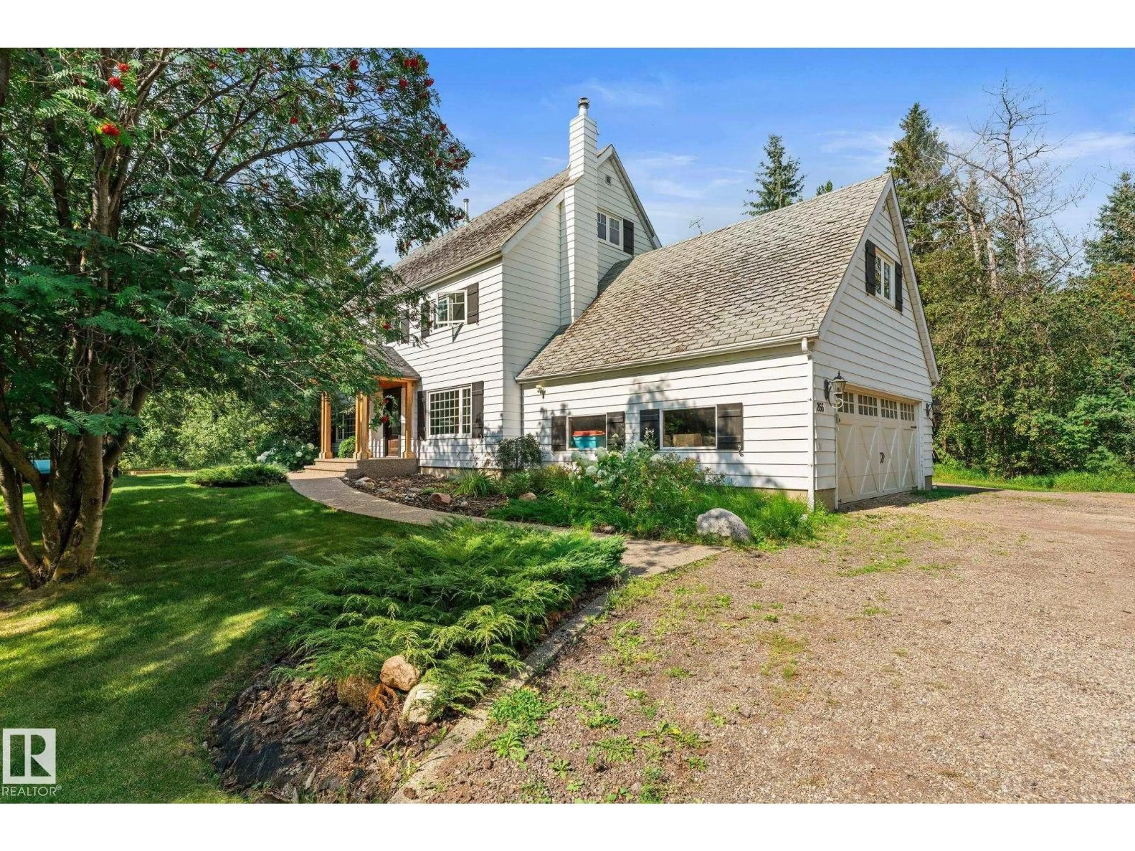 A pic from outside/outdoor area/front of a property/back of a property/a pic from drone, unknown for 266 52249 RGE ROAD 233, Rural Strathcona County Alberta T8B1C7