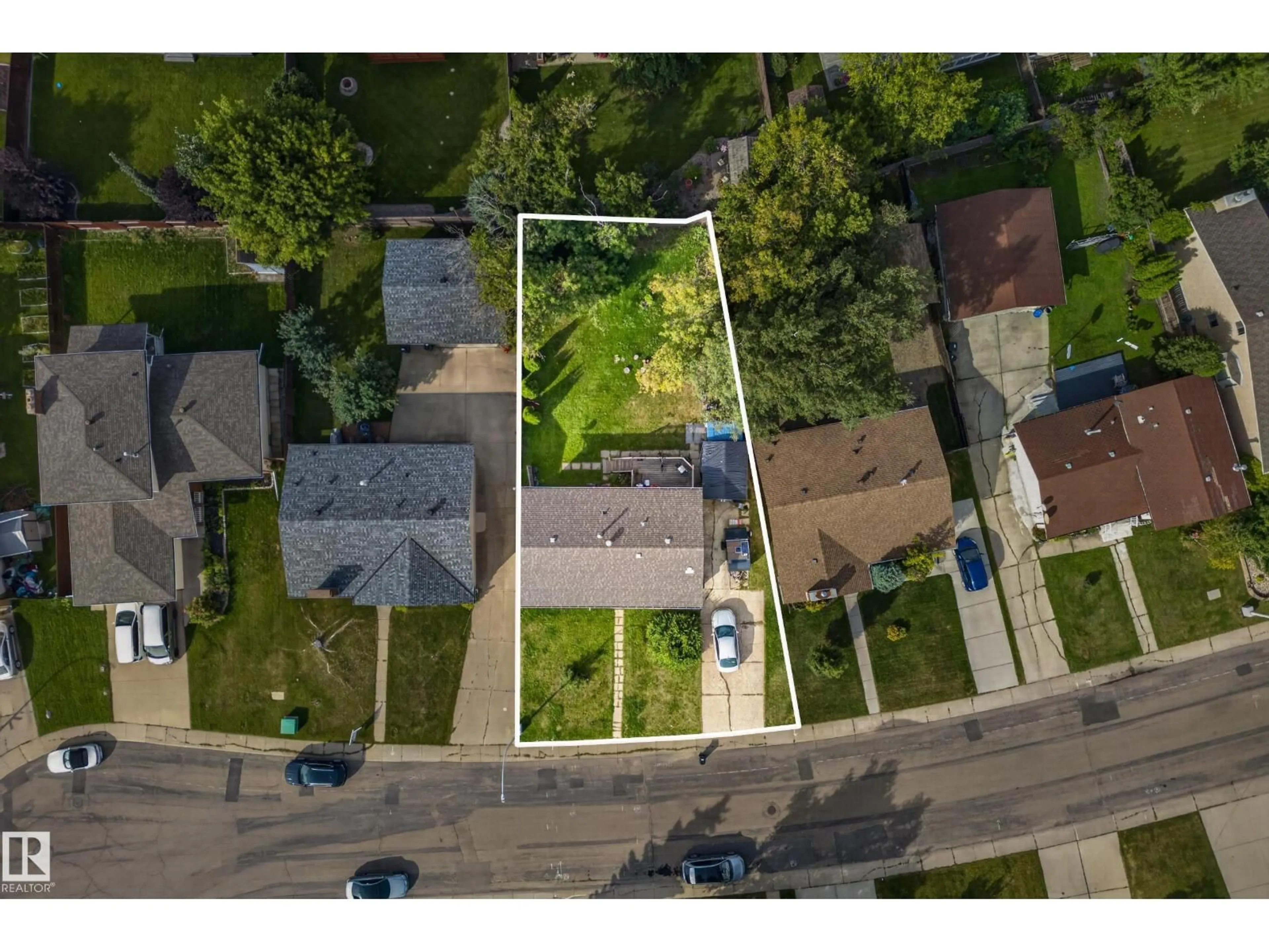A pic from outside/outdoor area/front of a property/back of a property/a pic from drone, street for 2412 80 ST, Edmonton Alberta T6K3P6