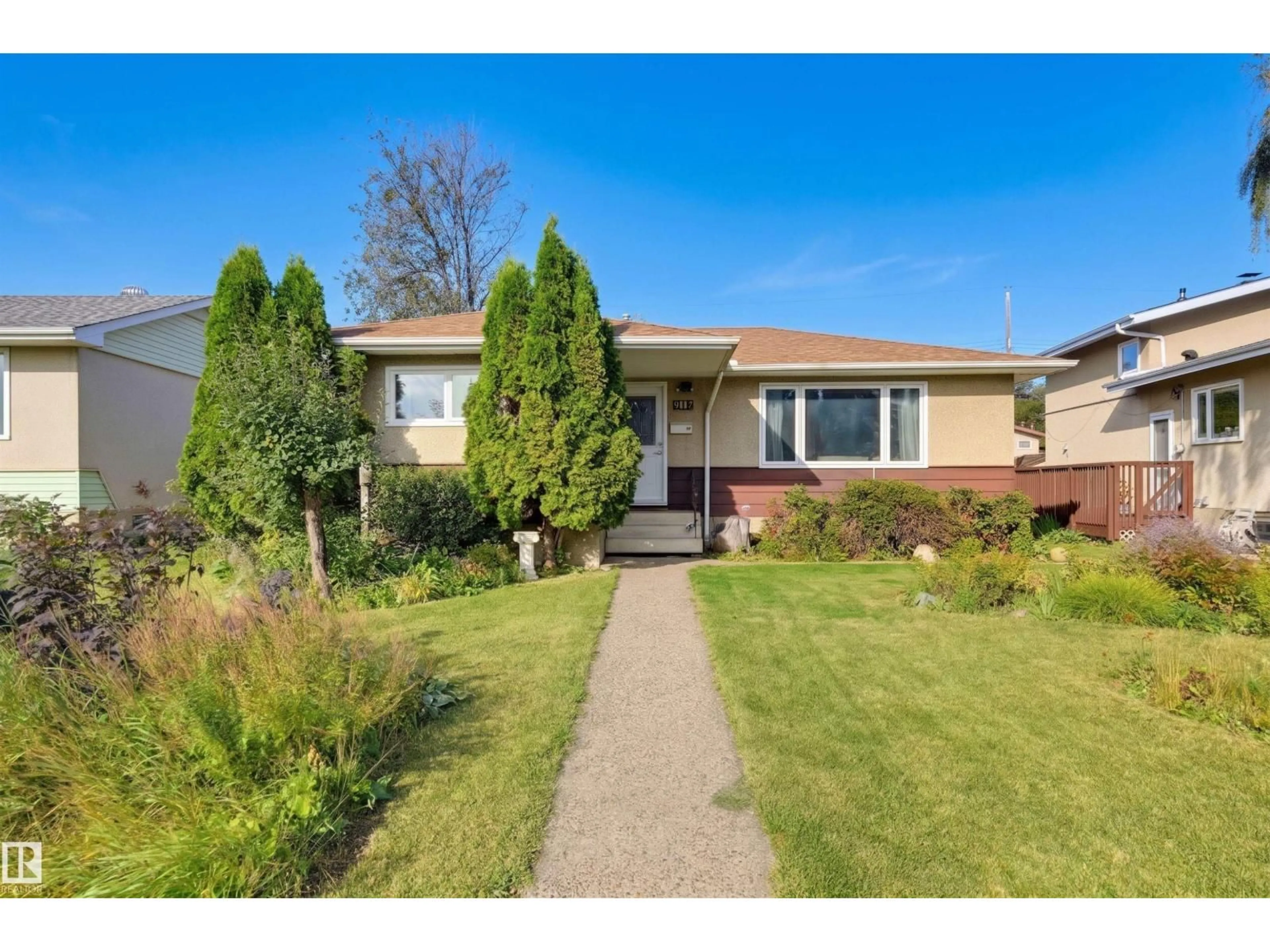 Home with vinyl exterior material, street for NW - 9122 167 ST, Edmonton Alberta T5R2T9