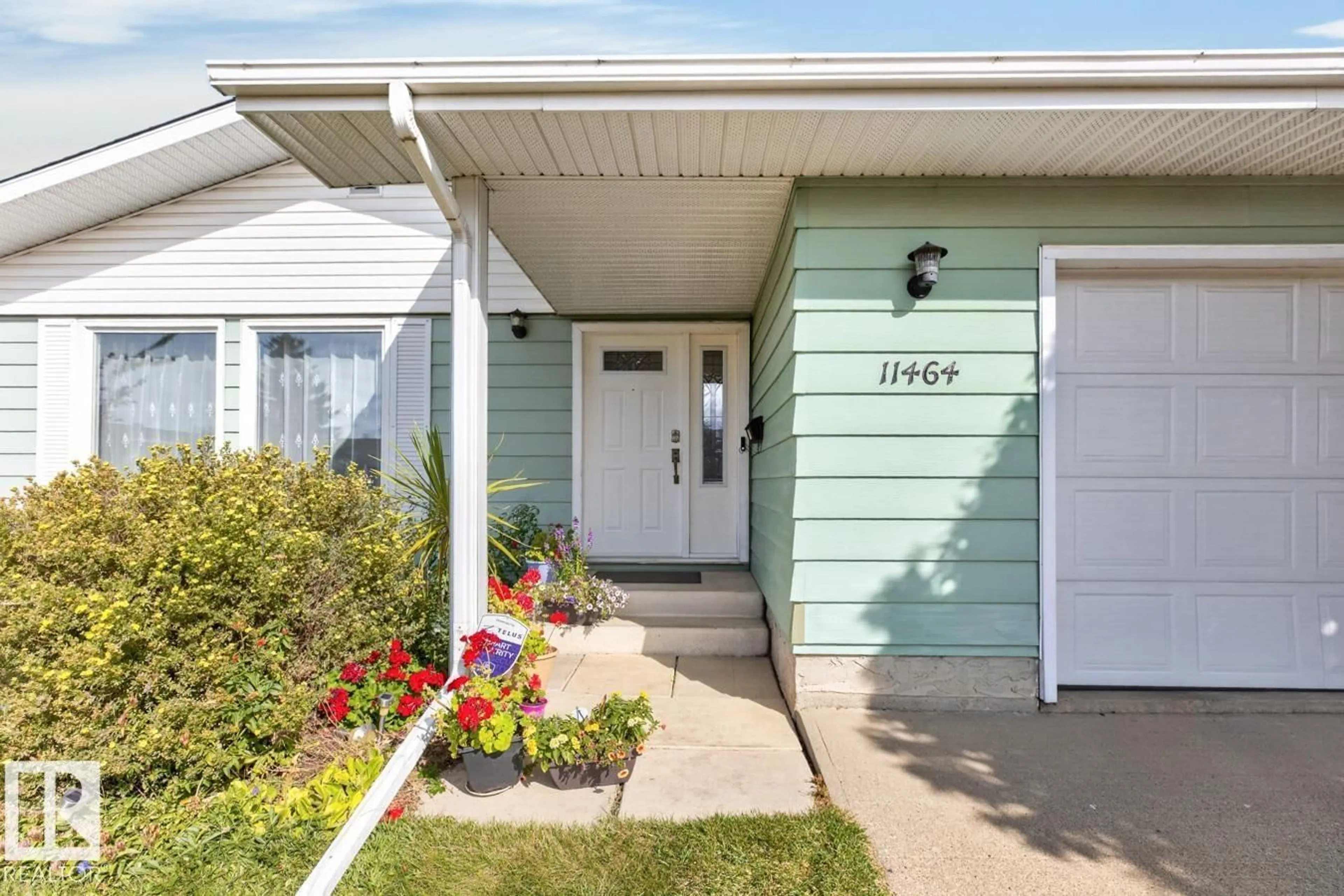 Home with vinyl exterior material, street for 11464 152A AV, Edmonton Alberta T5X1E2