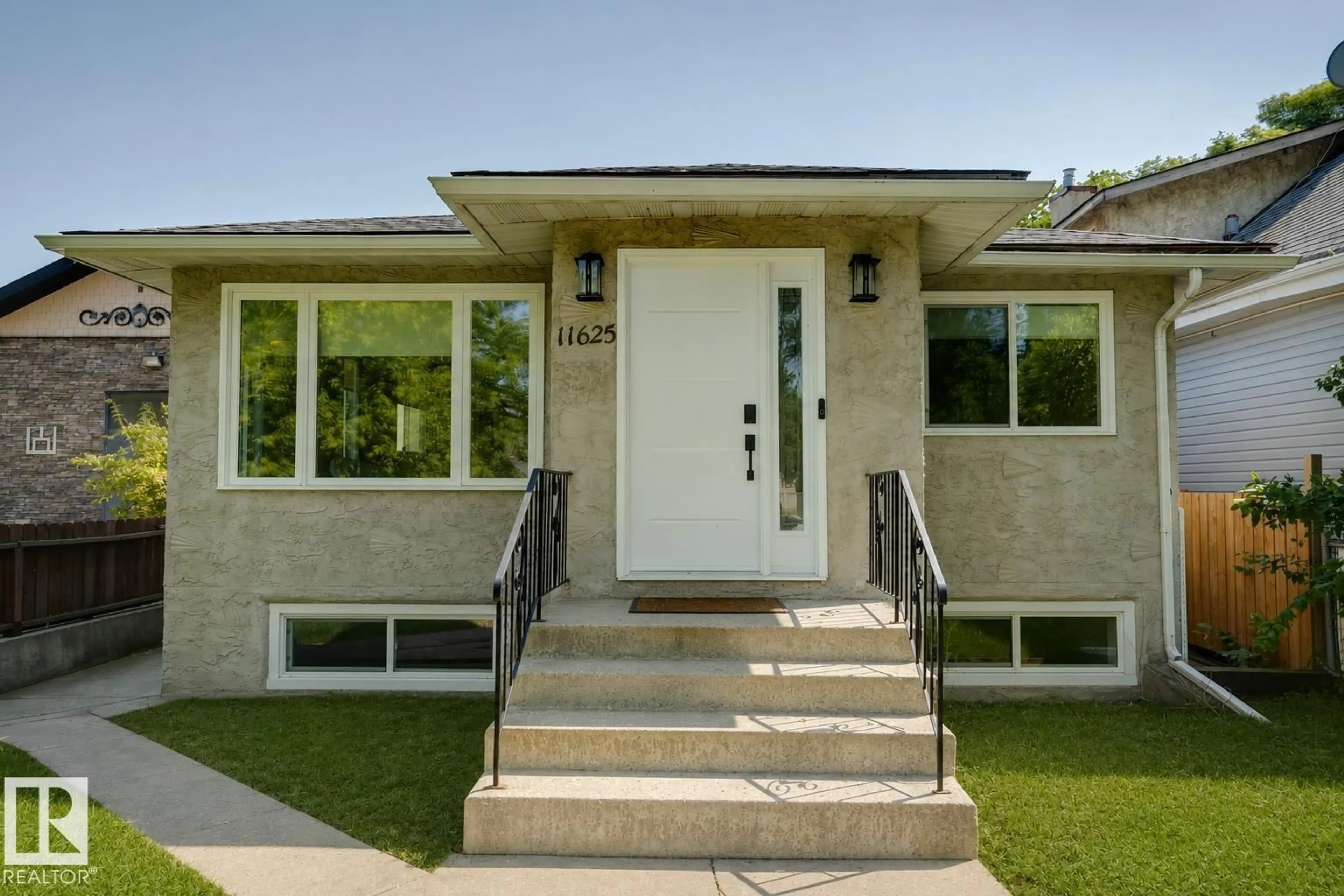 Home with vinyl exterior material, street for NW - 11625 83 ST, Edmonton Alberta T5B2Y7