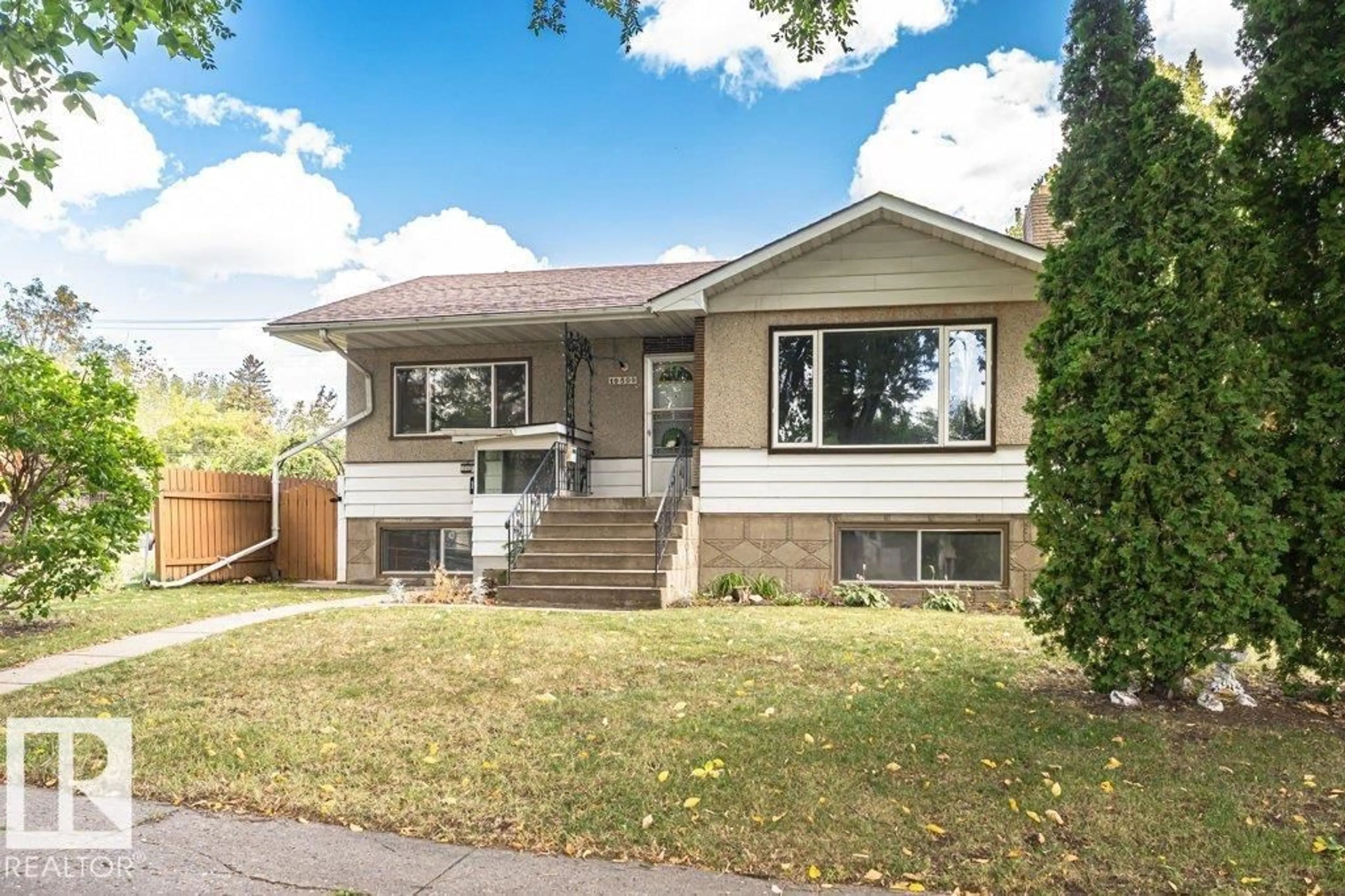 Home with vinyl exterior material, street for 10509 77 ST, Edmonton Alberta T6A3C8