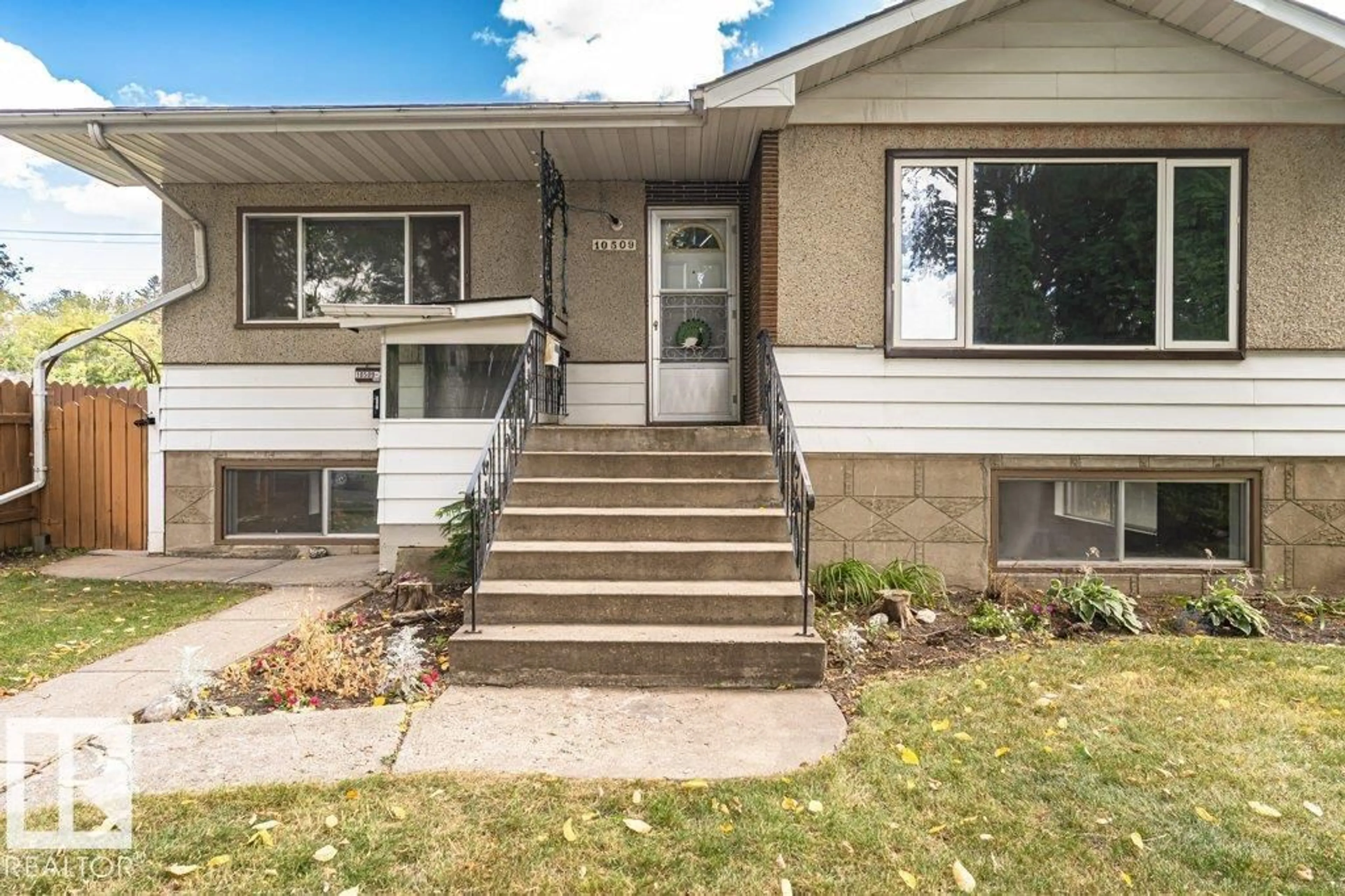 Home with vinyl exterior material, street for 10509 77 ST, Edmonton Alberta T6A3C8