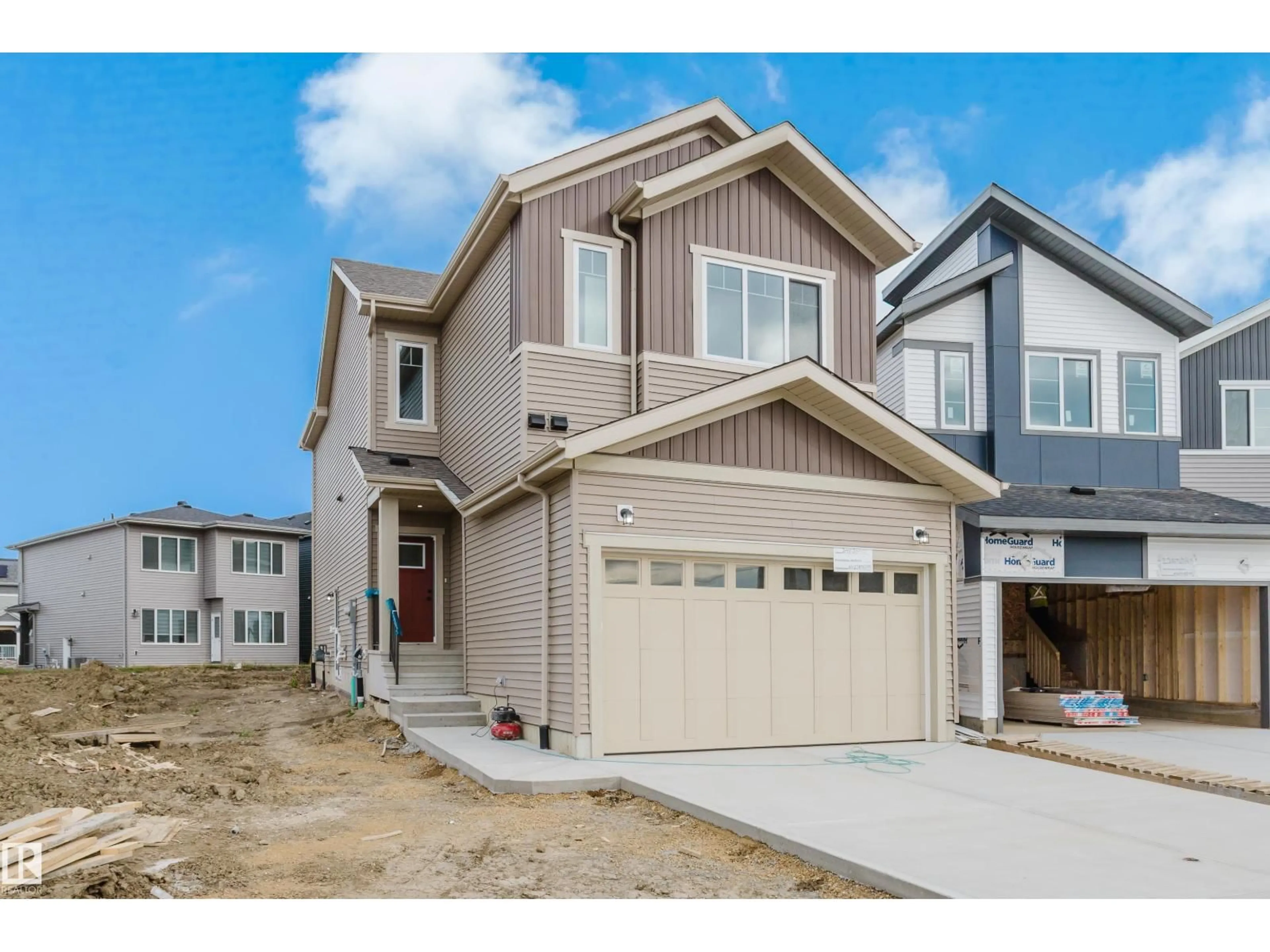 Home with vinyl exterior material, street for NW - 2411 209 ST, Edmonton Alberta T6M3L4