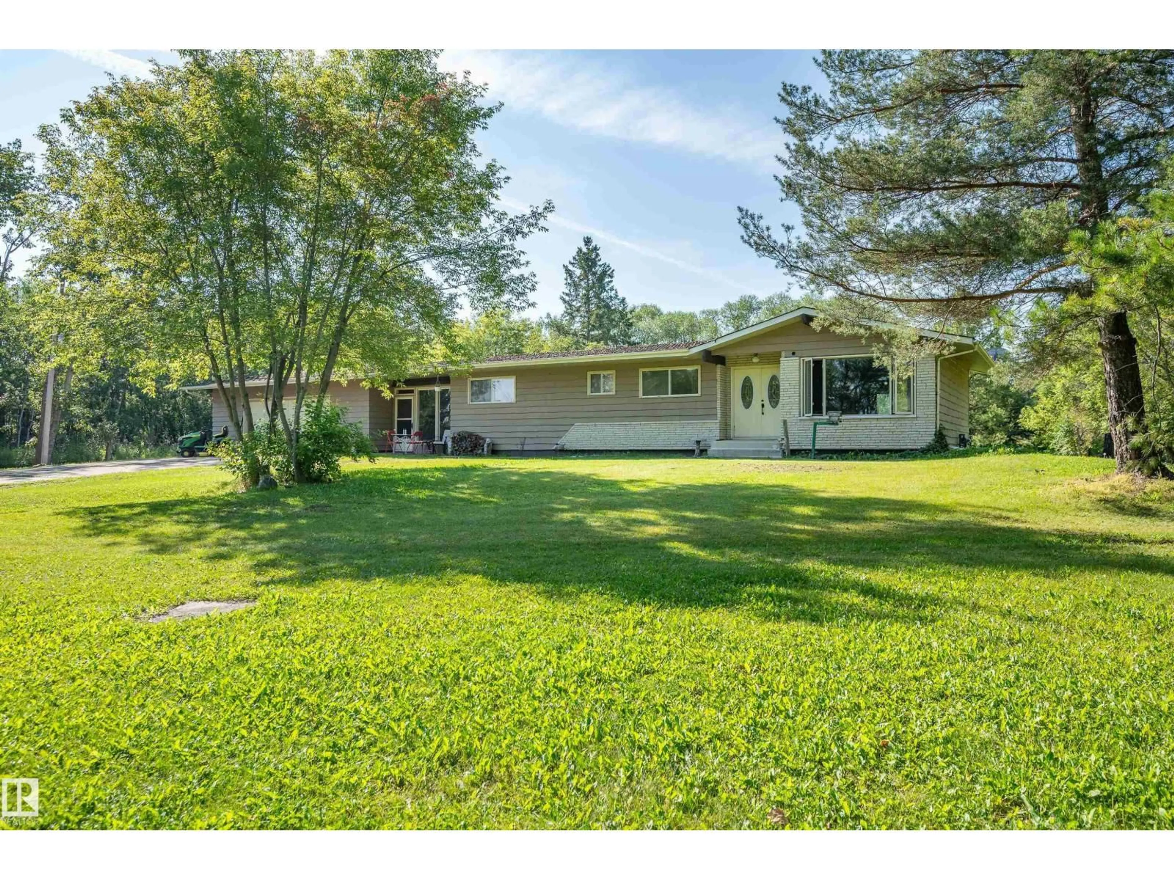A pic from outside/outdoor area/front of a property/back of a property/a pic from drone, unknown for 109 - 52312 RGE ROAD 223, Rural Strathcona County Alberta T8C1B3